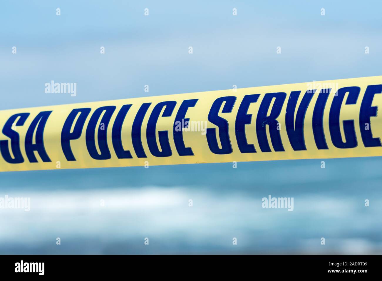 yellow tape at a crime scene in South Africa with the text or words S A police service concept public safety, security, emergency services Stock Photo