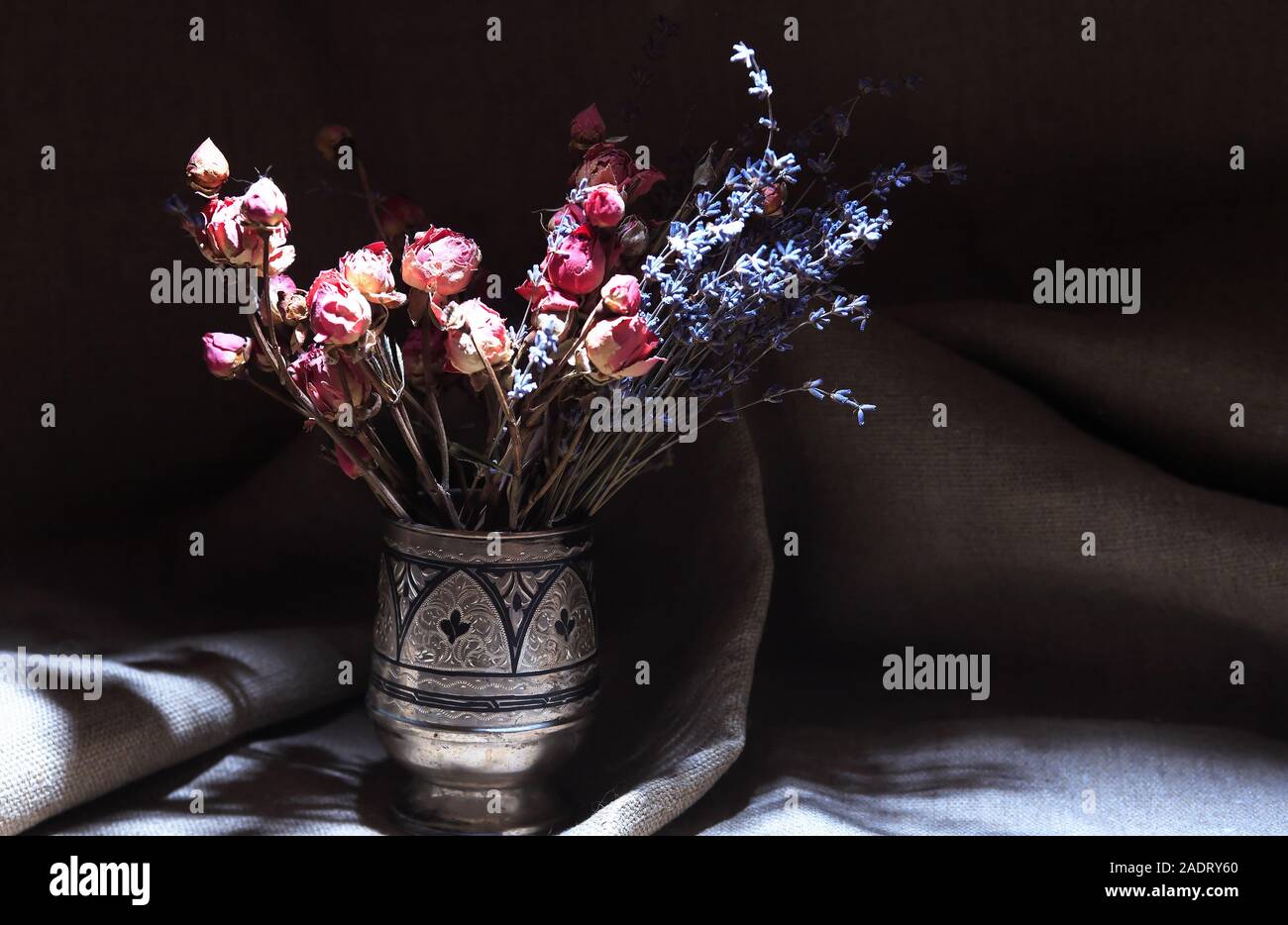 Vintage still life with bouquet of dried flowers in a silver vase Stock ...