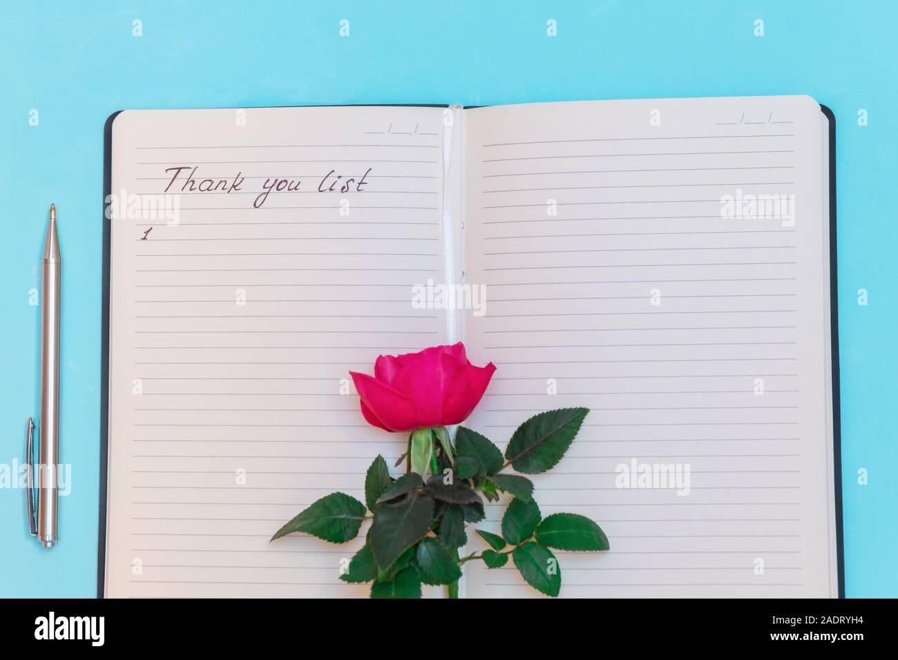 Flat lay with gratitude journal with handwritten words "Thank you list