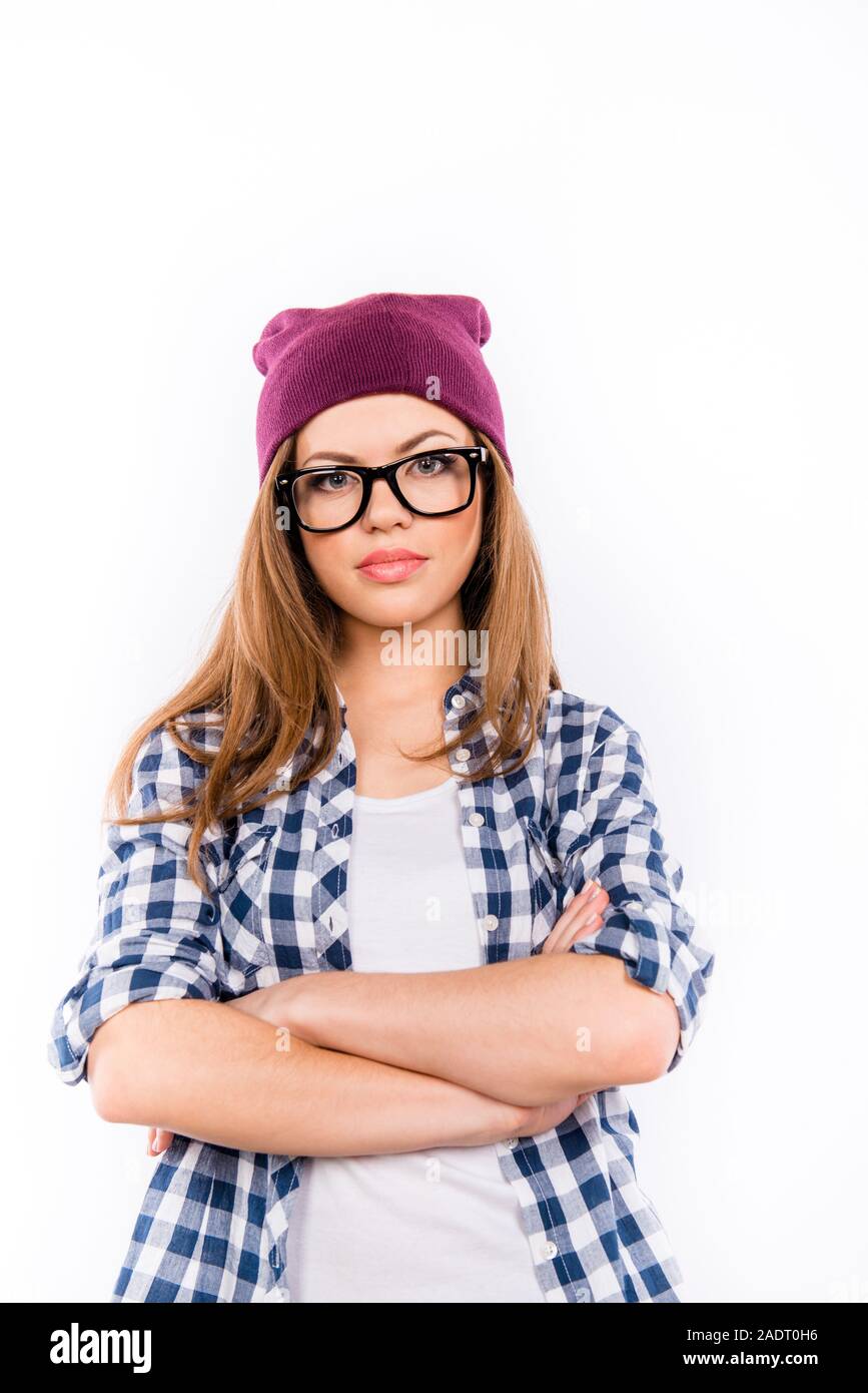 beautiful serios girl in a hipster hat crossed her arms Stock Photo