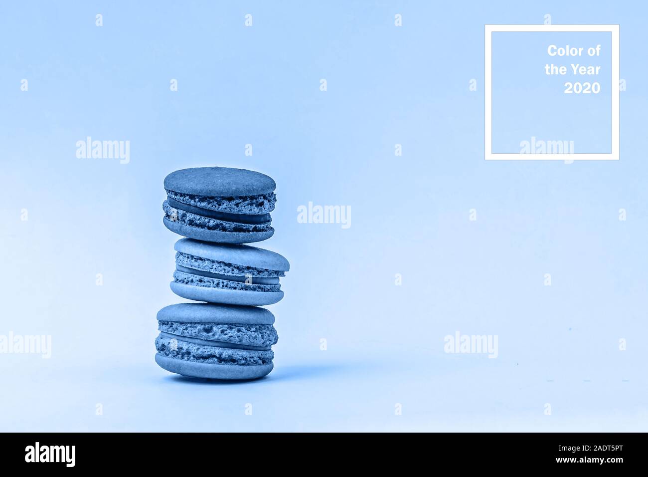 Assorted macaroons toned blue color background with copy space Stock ...