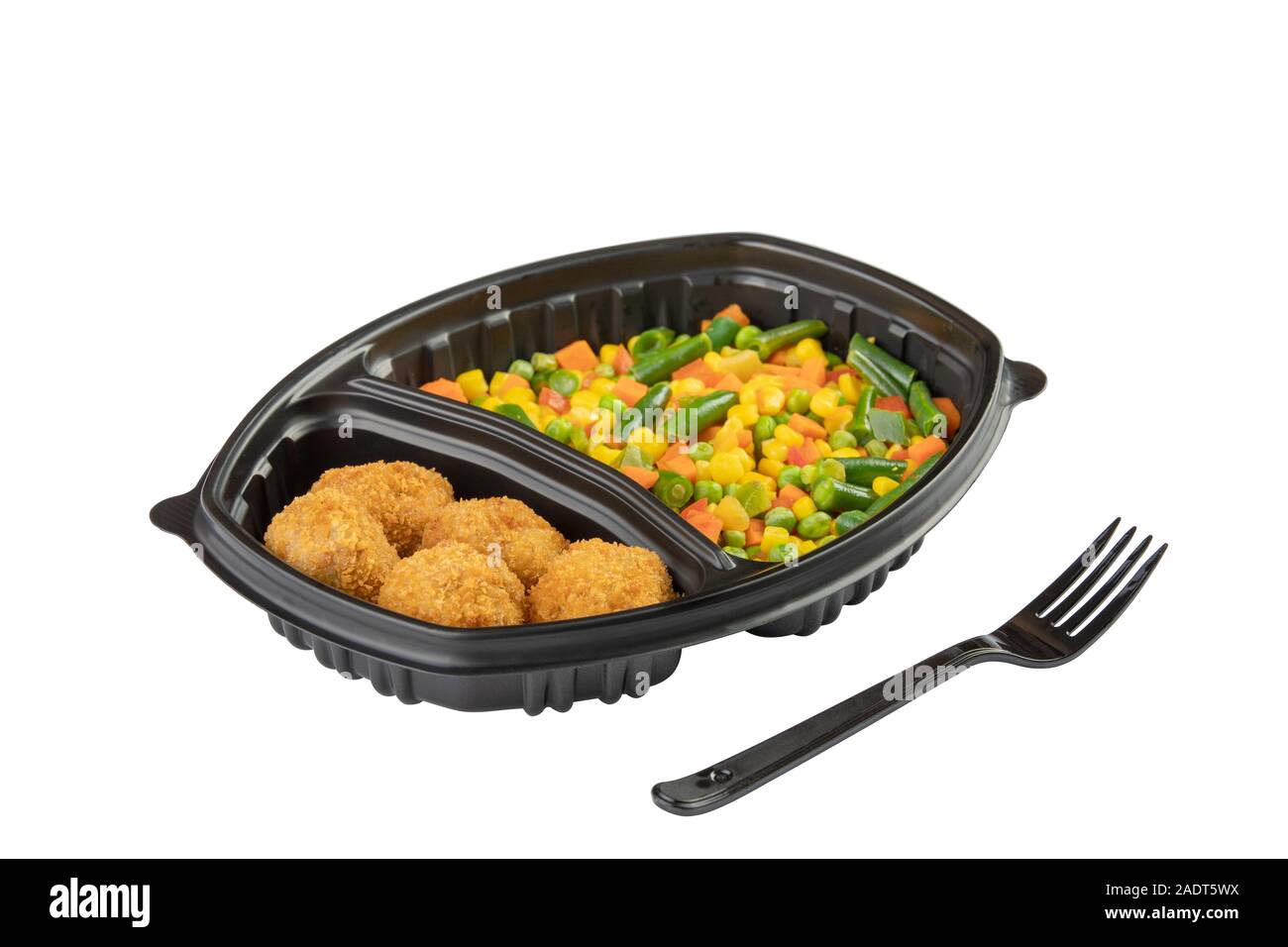 Chicken nugets with sidedish vegetables in plastic disposable