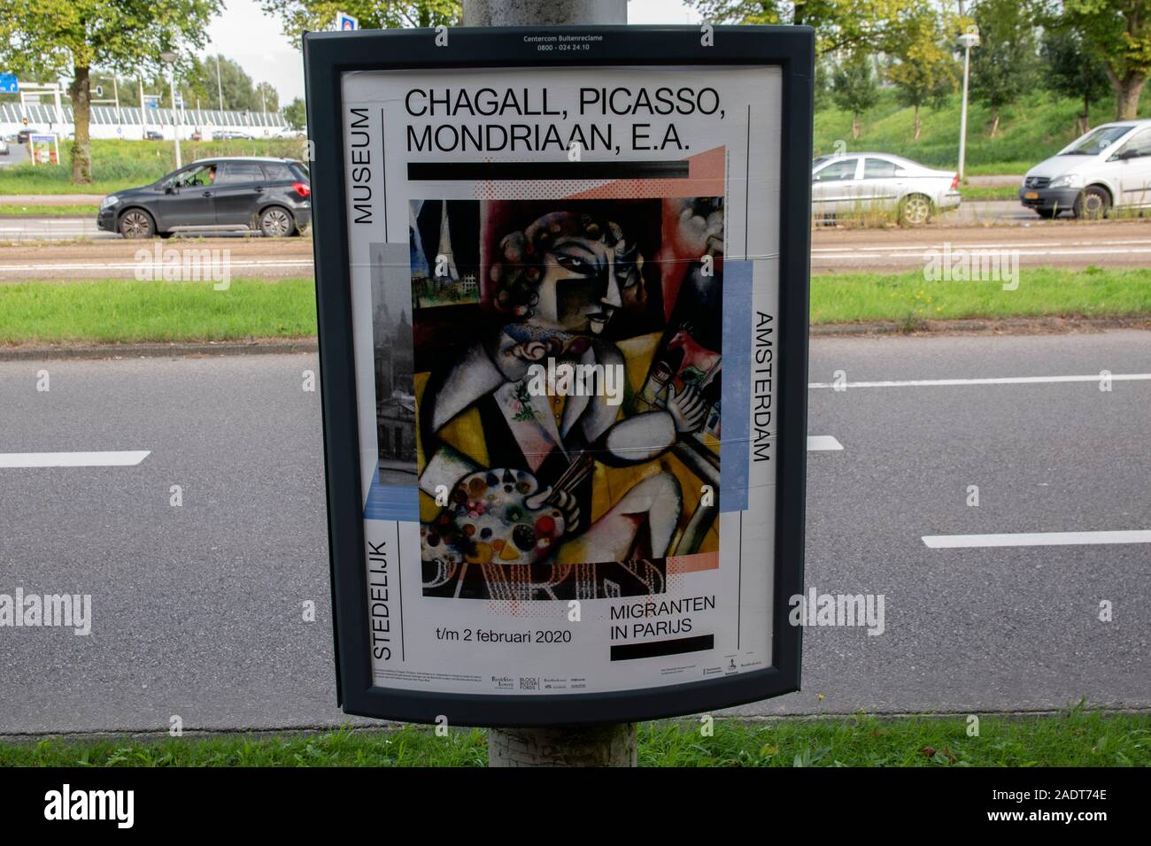 Billboard Migranten In Parijs Exhibition At The Stedelijk Museum Amsterdam The Netherlands 2019 Stock Photo