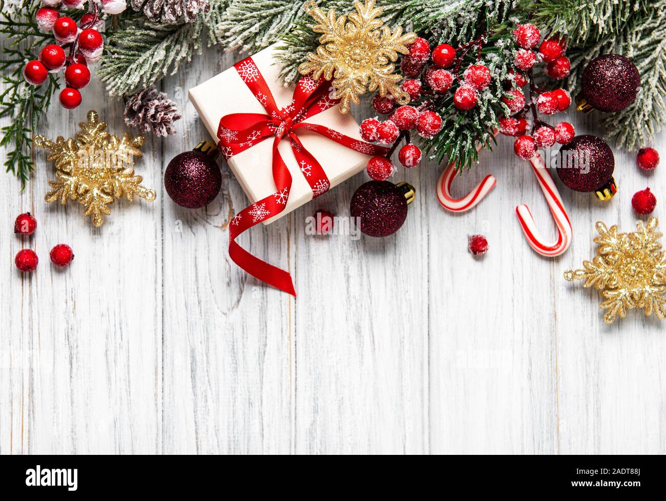 Christmas and New year background with fir branches, holly berry, pine ...