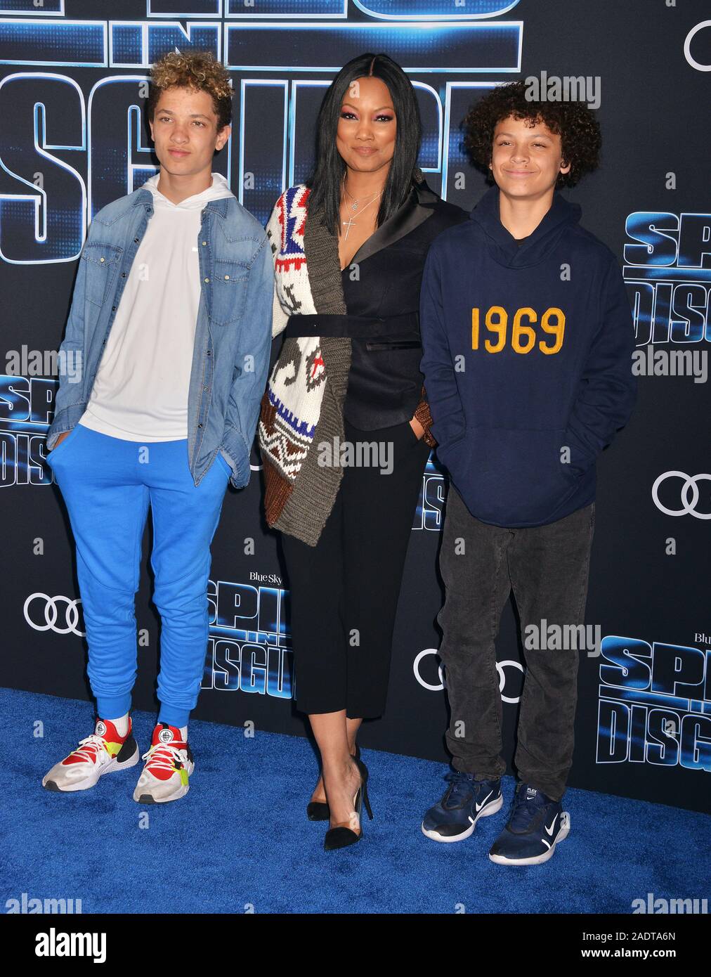 Los Angeles, USA. 4th Dec, 2019. Jaid Thomas Nilon, actress Garcelle Beauvais and Jax Joseph Nilon attends the premiere of 20th Century Fox's 'Spies In Disguise' at El Capitan Theatre on December 04, 2019 in Los Angeles, Credit: Tsuni/USA/Alamy Live News Stock Photo