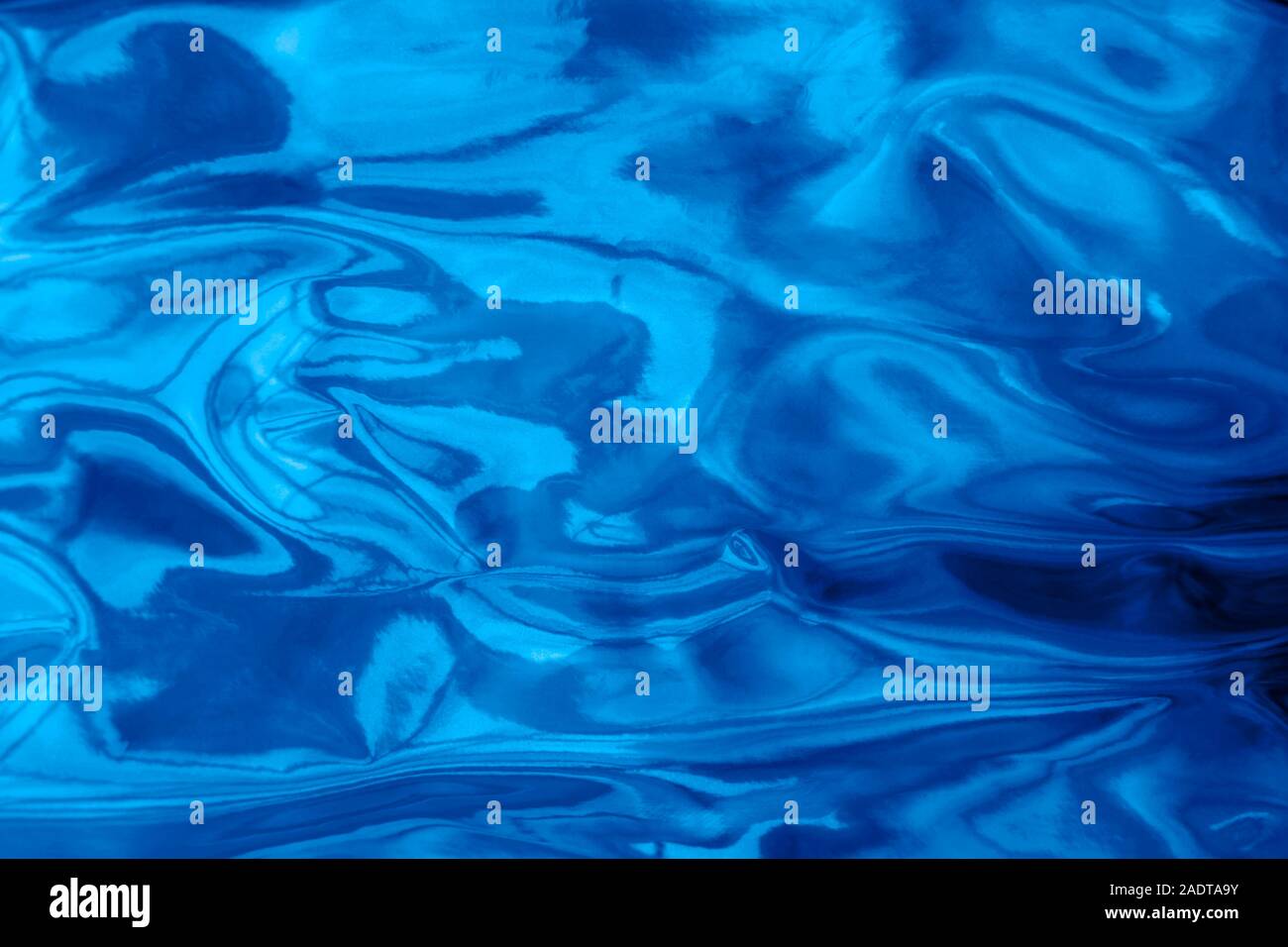 Holographic wrinkled abstract foil texture. Glittering blurred surface ...