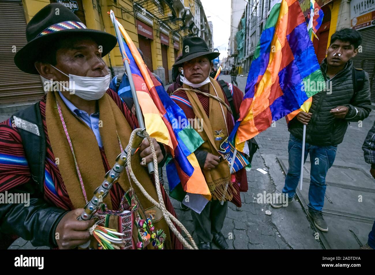 La Paz, La Paz, Bolivia. 13th Nov, 2019. Clashes in La Paz/Bolivia. ''ponchos rojos'' Pro Evo morales peasant after tear gas. Clashes with Police during riots between pro and anti Evo Morales demonstrators . Demonstrators have taken to the streets in Bolivia after the counting of votes on October 2019 presidential election descended into controversy about a massive fraud from the Evo Morales MAS party.The country's opposition has accused the government of President Evo Morales of fraud after the count was mysteriously suspended for 24 hours during the votes counting while pointing to th Stock Photo