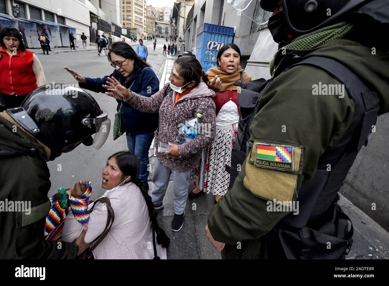 La Paz, La Paz, Bolivia. 13th Nov, 2019. Clashes in La Paz/Bolivia. Por Evo Morales protesters blocking the streets are being evacuated by Police.Demonstrators have taken to the streets in Bolivia after the counting of votes on October 2019 presidential election descended into controversy about a massive fraud from the Evo Morales MAS party.The country's opposition has accused the government of President Evo Morales of fraud after the count was mysteriously suspended for 24 hours during the votes counting while pointing to the need for a December run-off round between the incumbent and Stock Photo