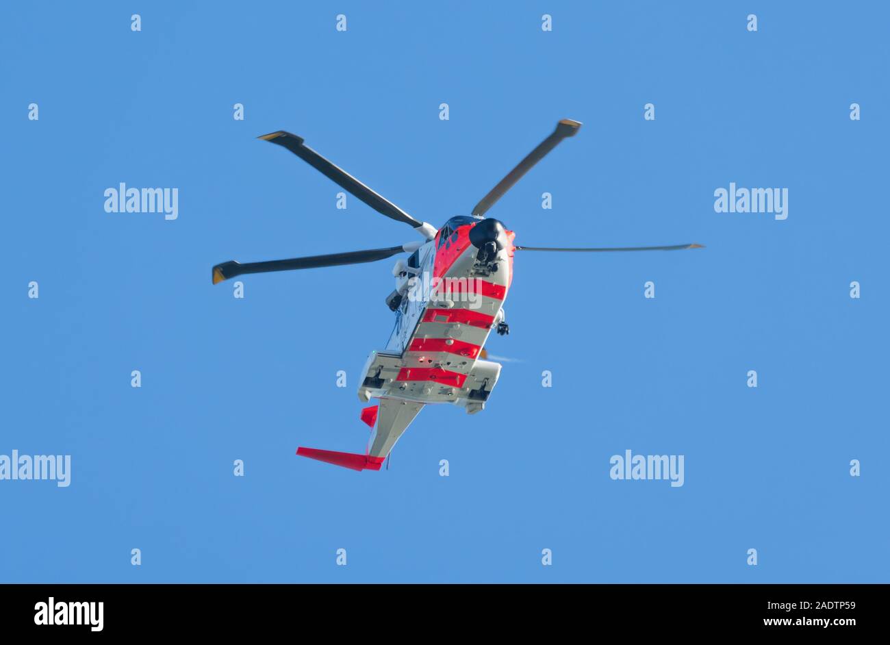 Underside of a AgustaWestland AW101 medium lift rescue helicopter (Norwegian SAR rescue helicopter) with retractable landing gear. Stock Photo