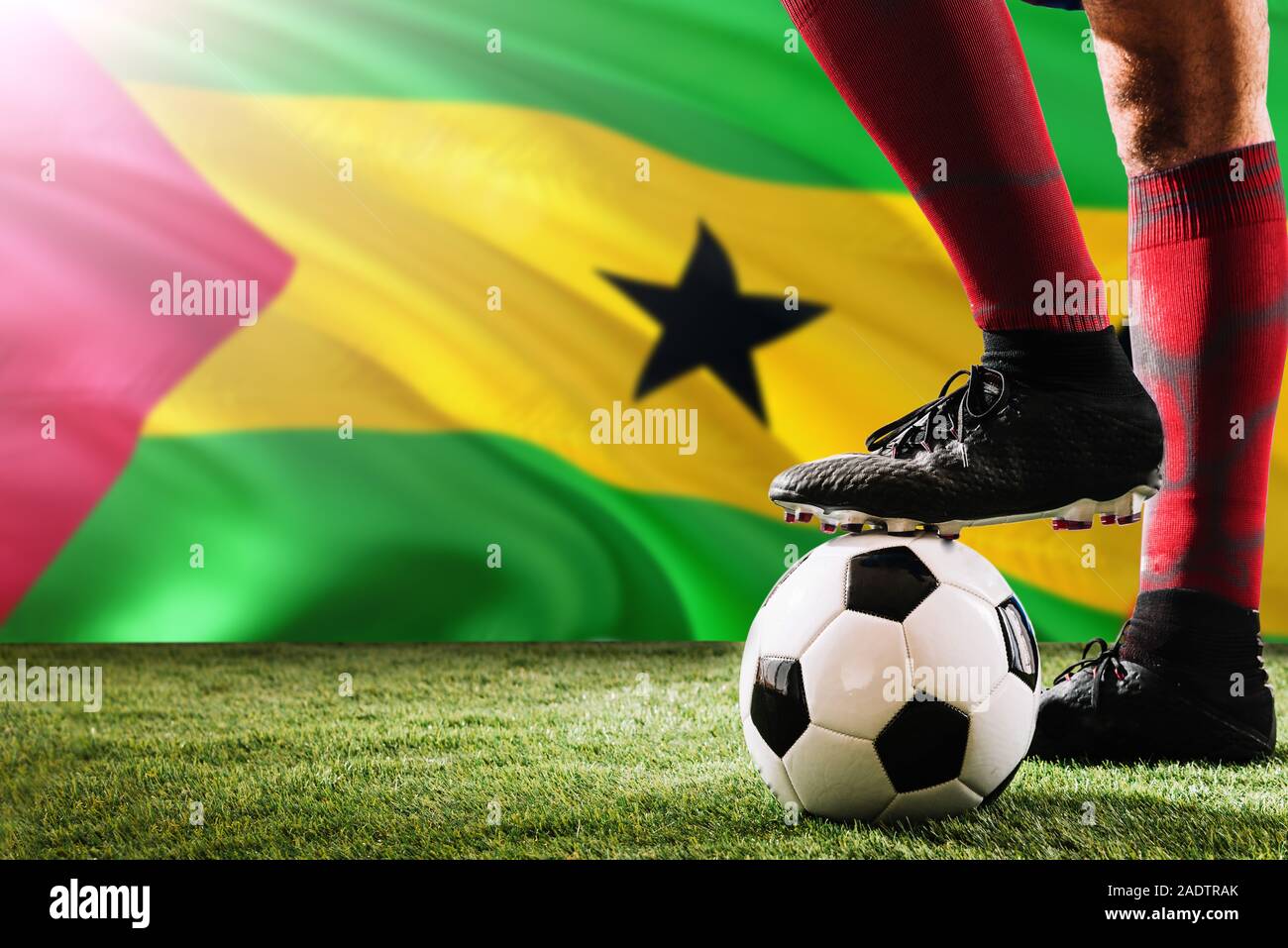 Close up legs of Sao Tome And Principe football team player in red socks,  shoes on soccer ball at the free kick or penalty spot playing on grass  Stock Photo - Alamy