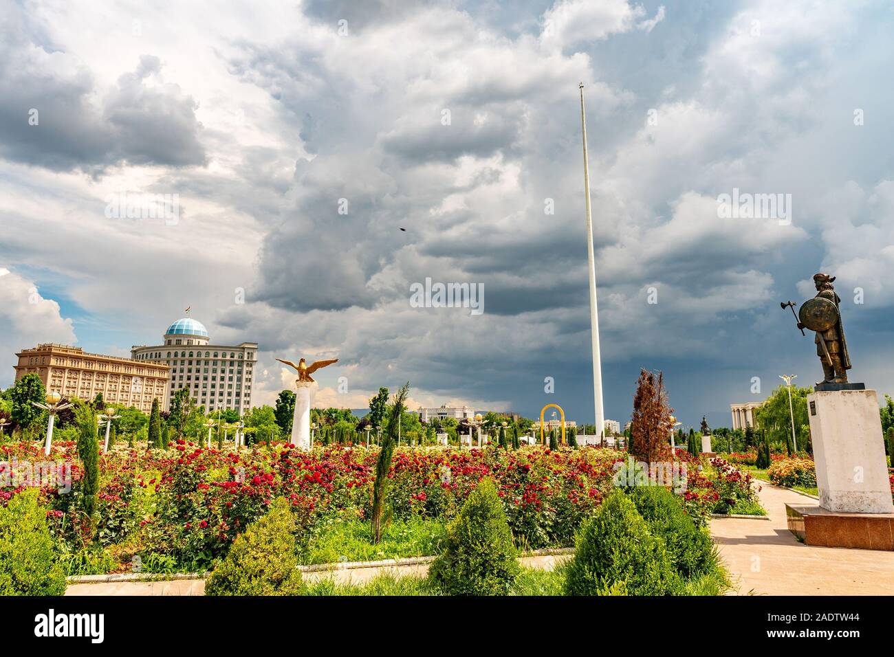 Dushanbe Flag Pole Park Picturesque View of Tajikistan National Museum with King Khushnavaz Statue on a Sunny Blue Sky Day Stock Photo