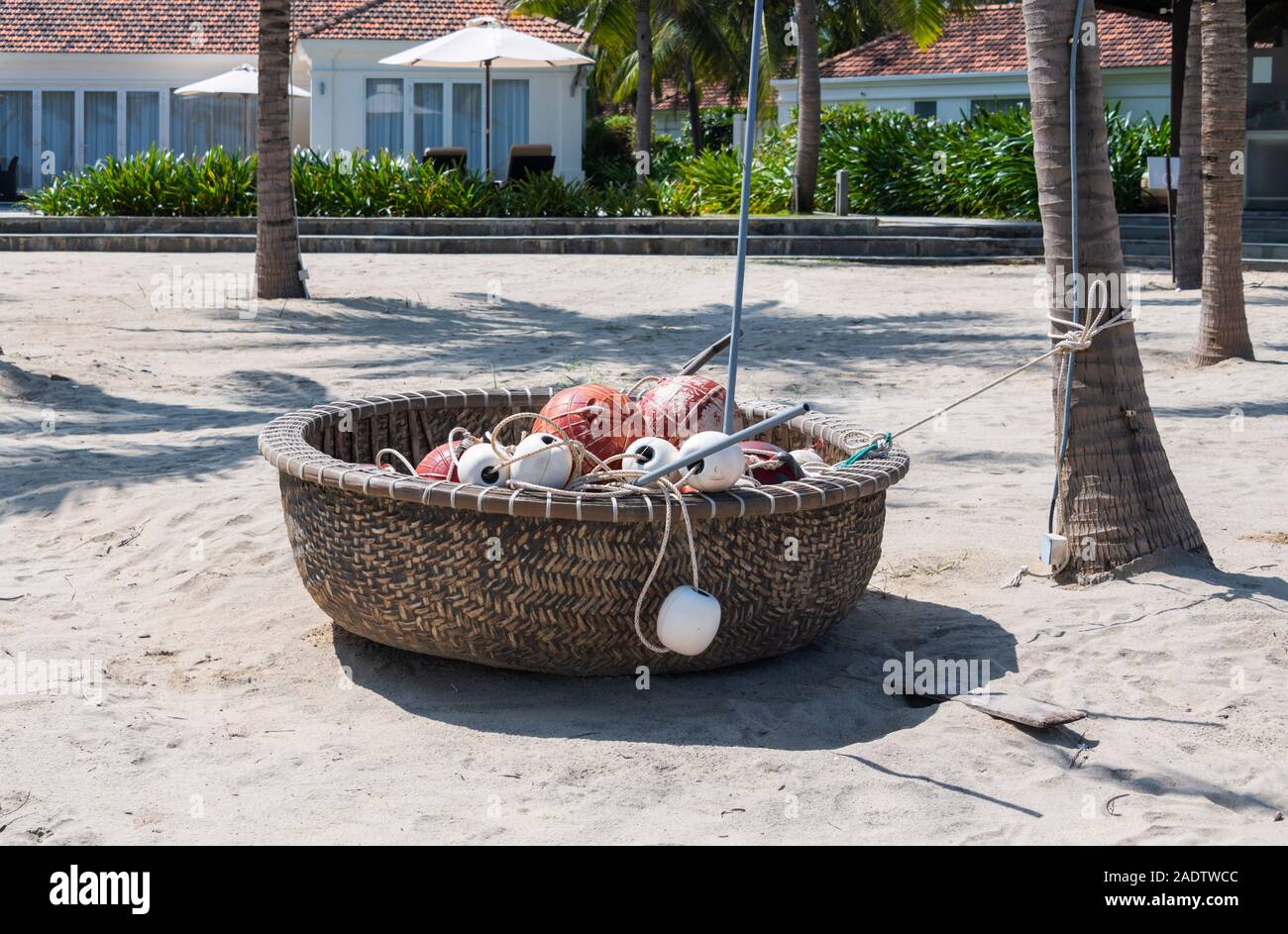 Vietnamese woven coracle bamboo basket boat on beach Hoi Ann Vietnam