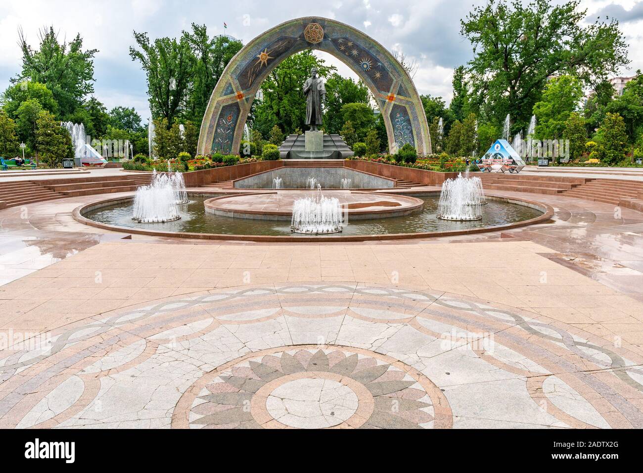 Dushanbe Abu Abdullah Rudaki Park Statue Picturesque View with Fountain on a Cloudy Rainy Day Stock Photo