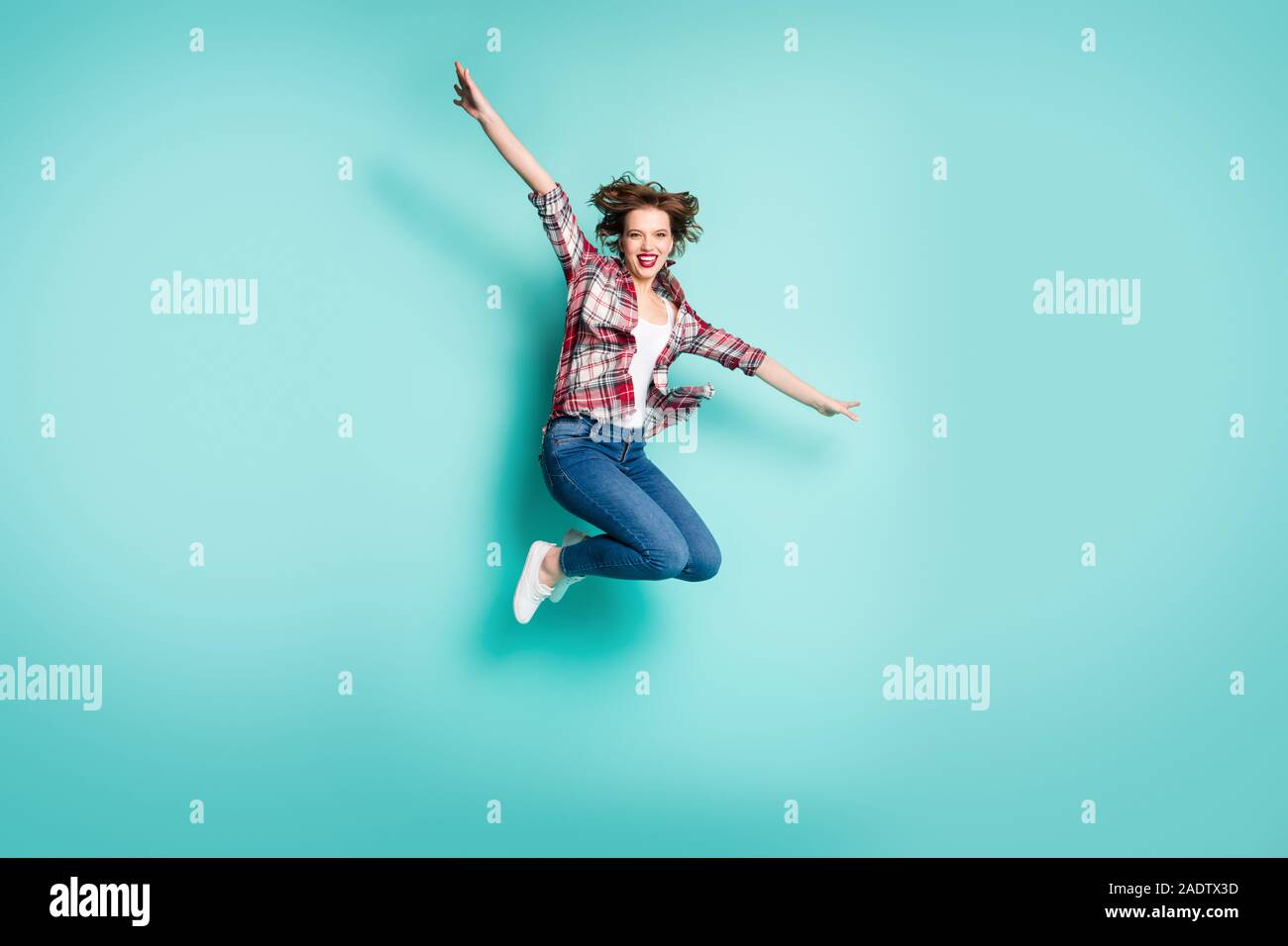 Full length photo of cheerful excited girl jump hold hands imagine idea ...