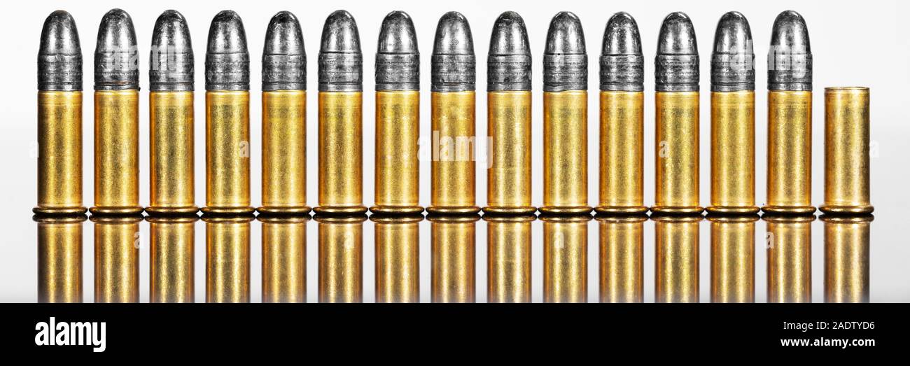 Panorama with row of cartridges or ammunition against white background, concepts such as business or arms exports Stock Photo