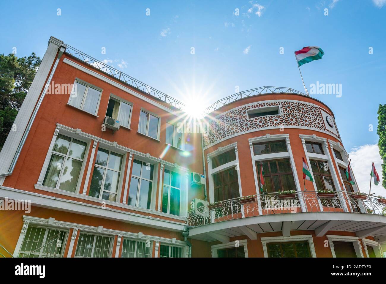 Dushanbe Ministry of Justice Building Breathtaking Picturesque View with Waving Tajikistan Flags on a Sunny Blue Sky Day Stock Photo