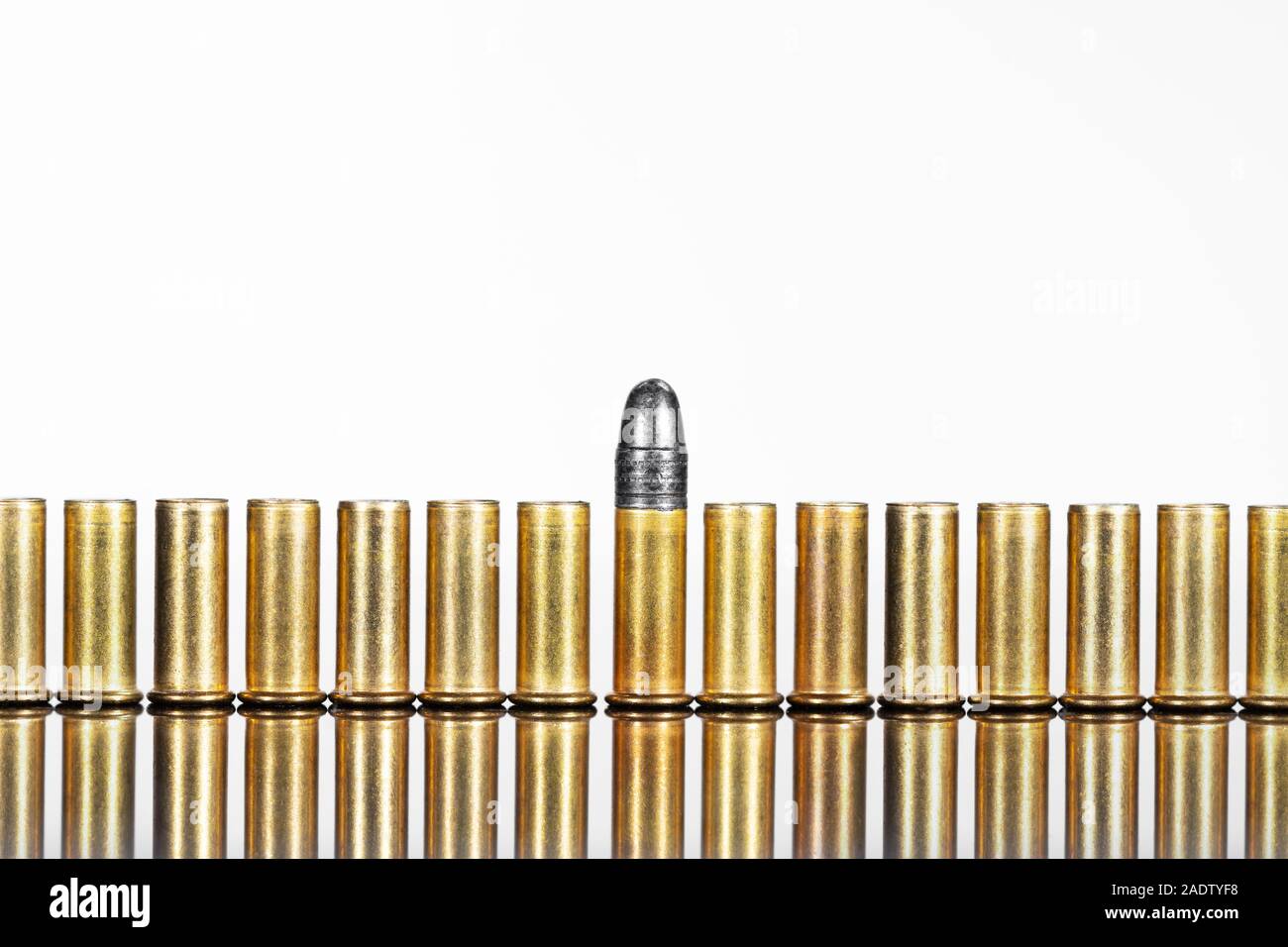 Series of cartridges or ammunition against white background, concepts such as business or arms exports Stock Photo