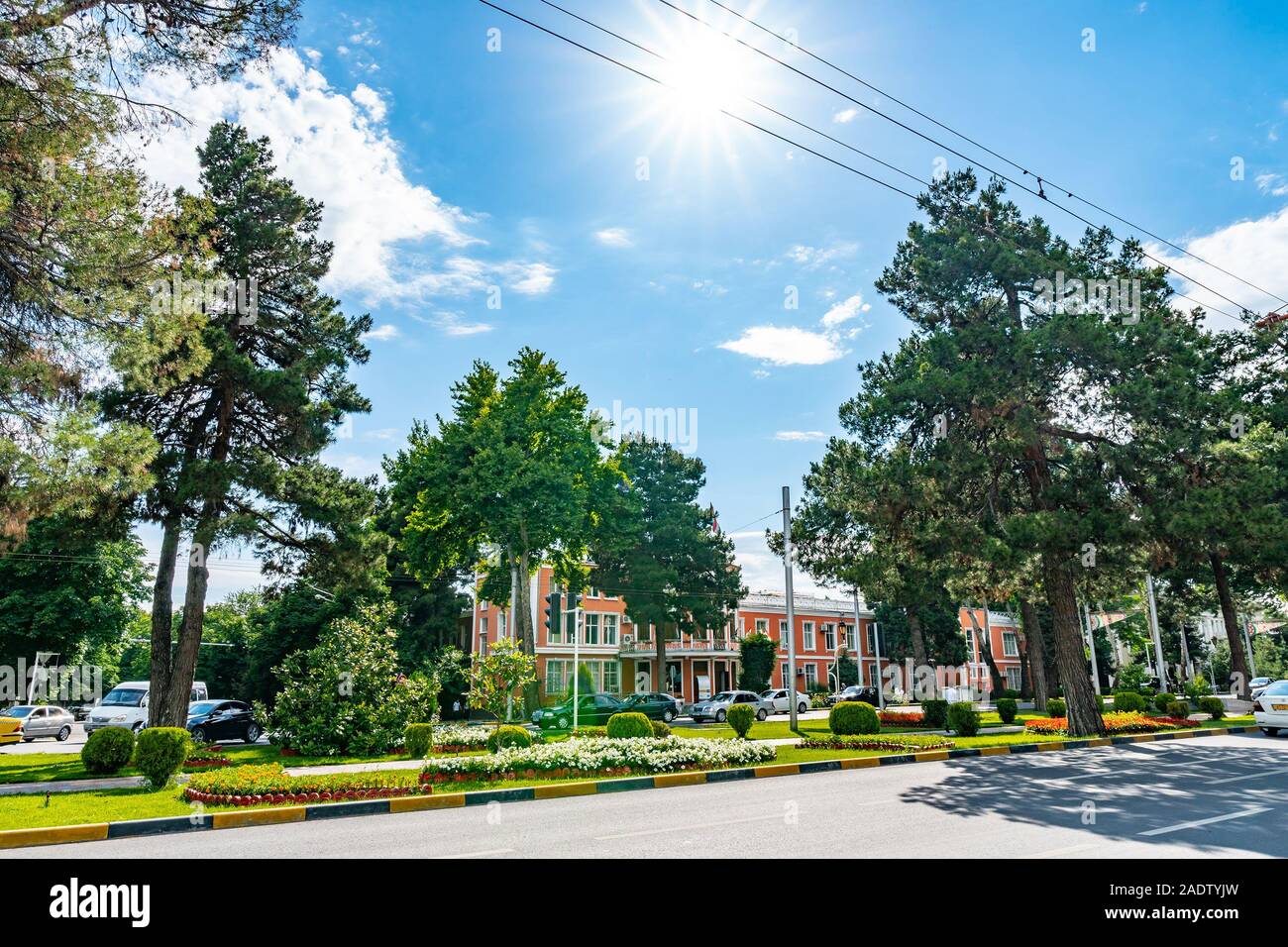 Dushanbe Ministry of Justice Building Breathtaking Picturesque View with Waving Tajikistan Flags on a Sunny Blue Sky Day Stock Photo