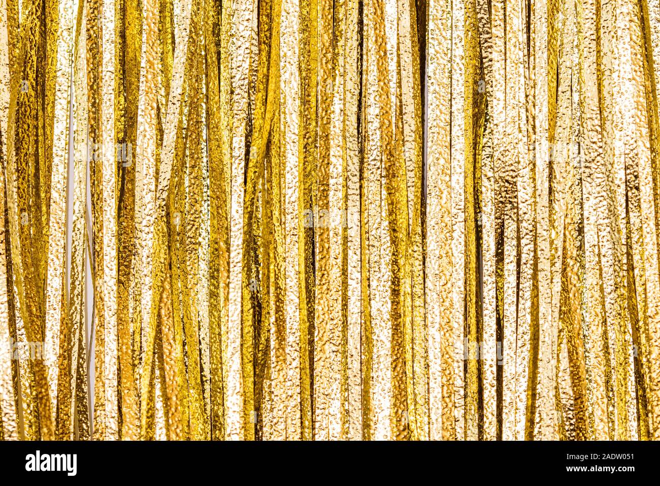 Details and texture from golden tinsel strips, christmas or festive