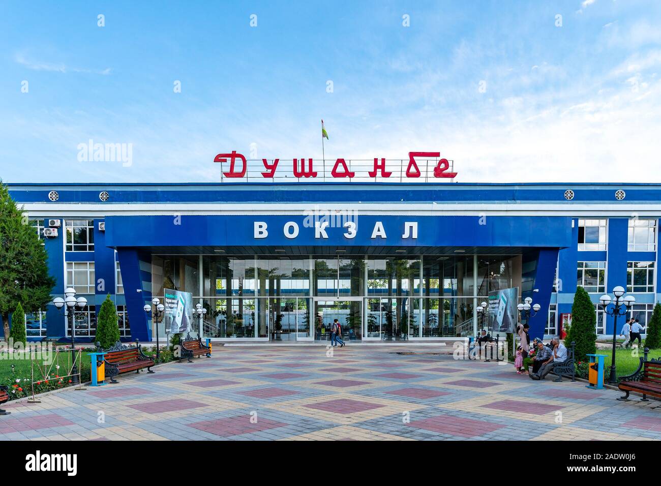 Dushanbe Main Railway Station Vokzal Picturesque View of Sitting People on Benches on a Sunny Blue Sky Day Stock Photo