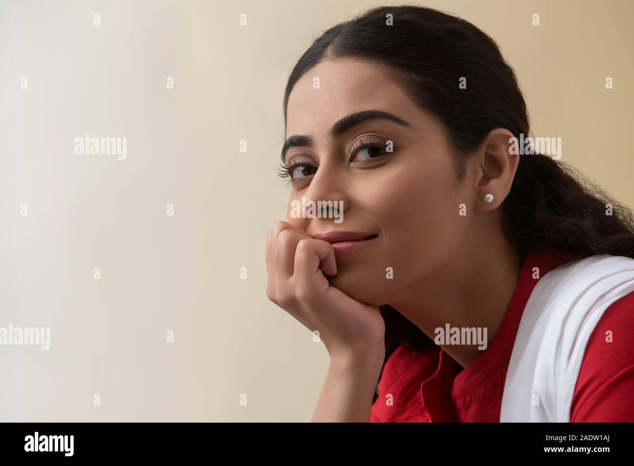 Stitting Single Portrait of a single woman sitting smiling Stock Photo - Alamy