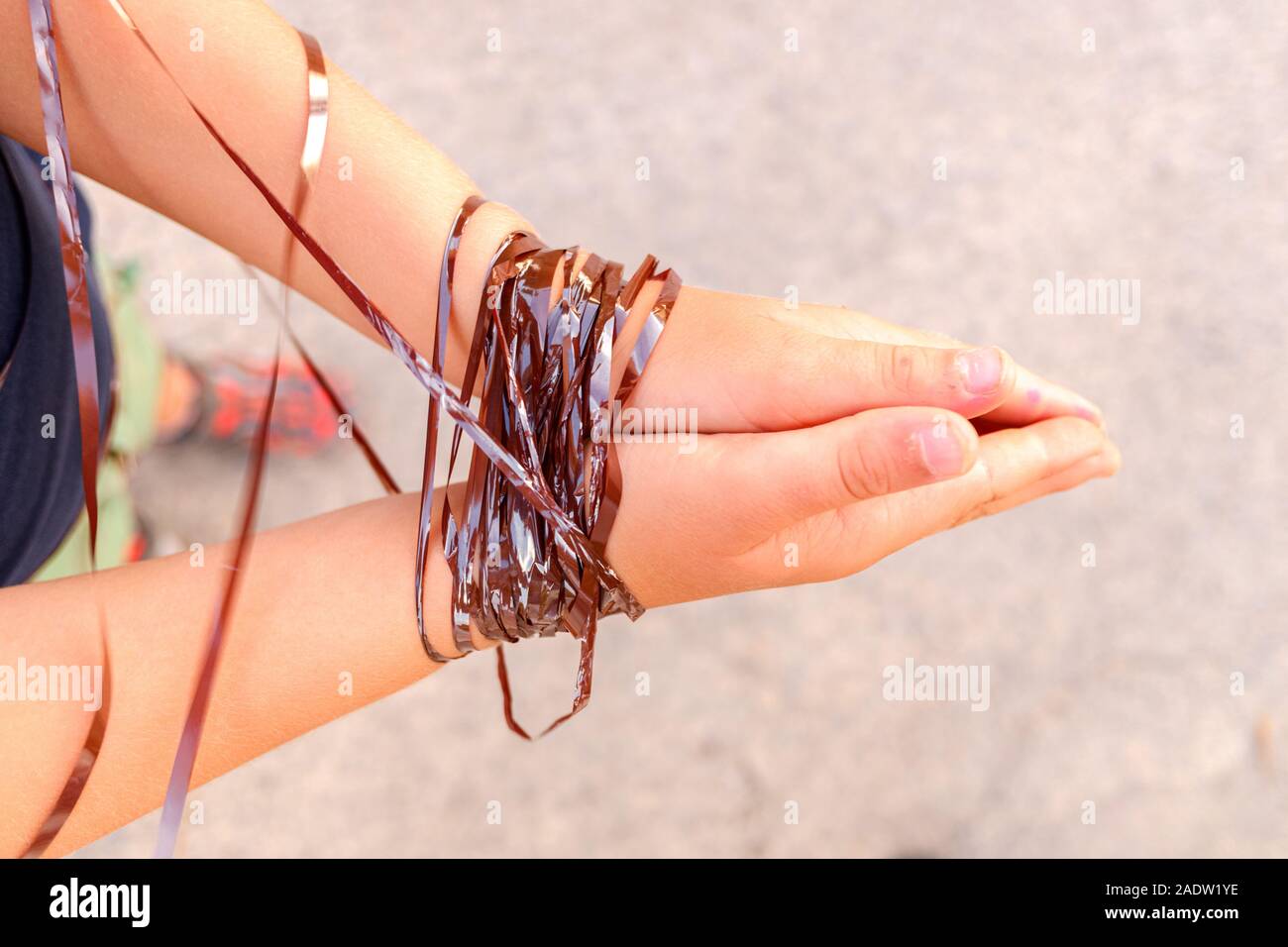 Tied hands, concept of lack of freedom and repression at different opinions. Stock Photo