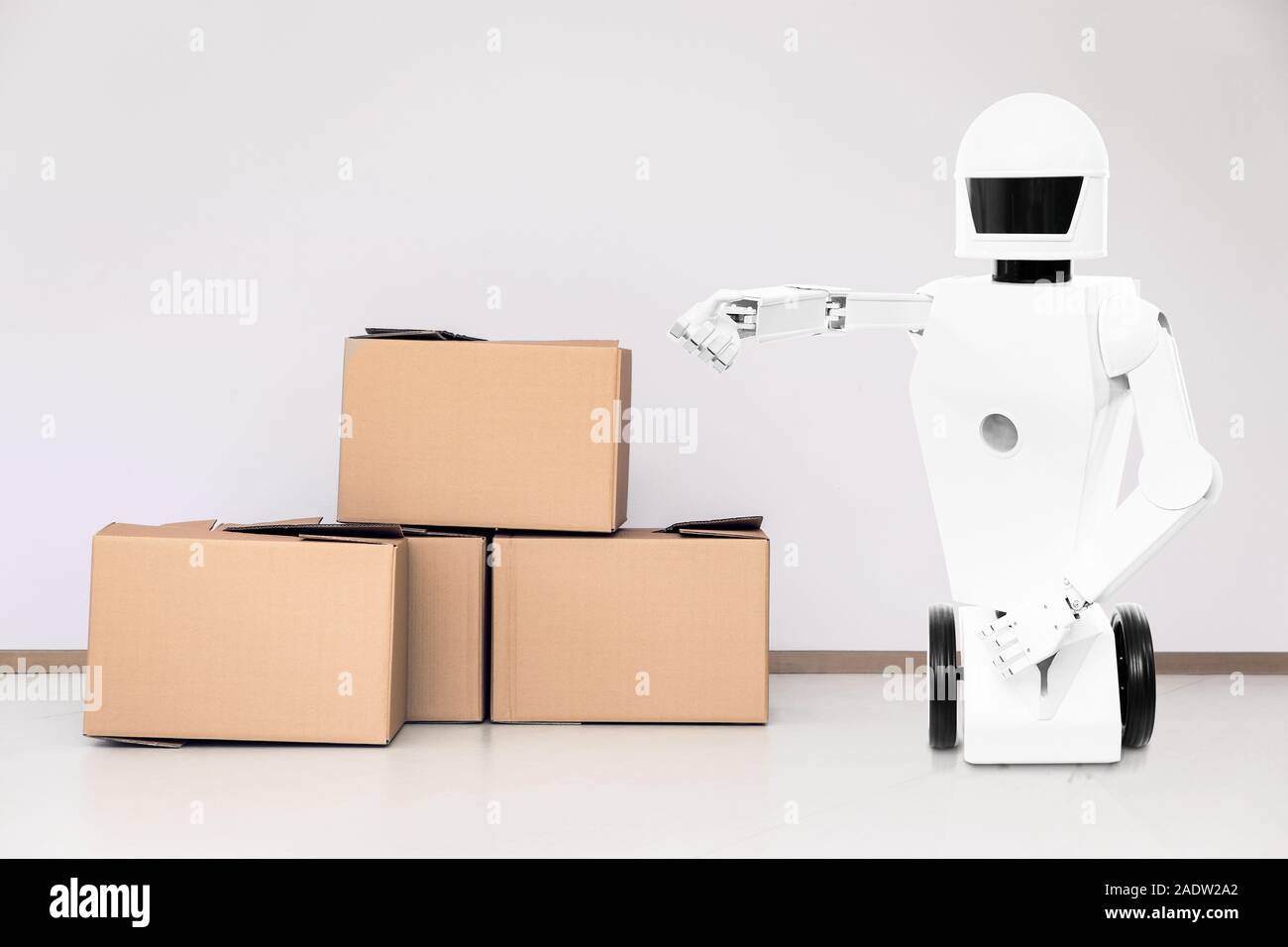 service roboter in a room with lot of boxes, concept moving company Stock Photo