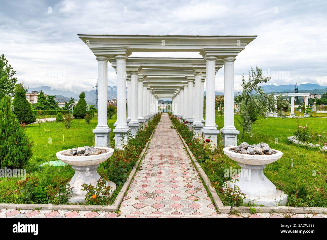 Dushanbe Amphitheater Park Picturesque Leading Lines Garden View at Ismoil Somoni Avenue on a Cloudy Rainy Sky Day Stock Photo