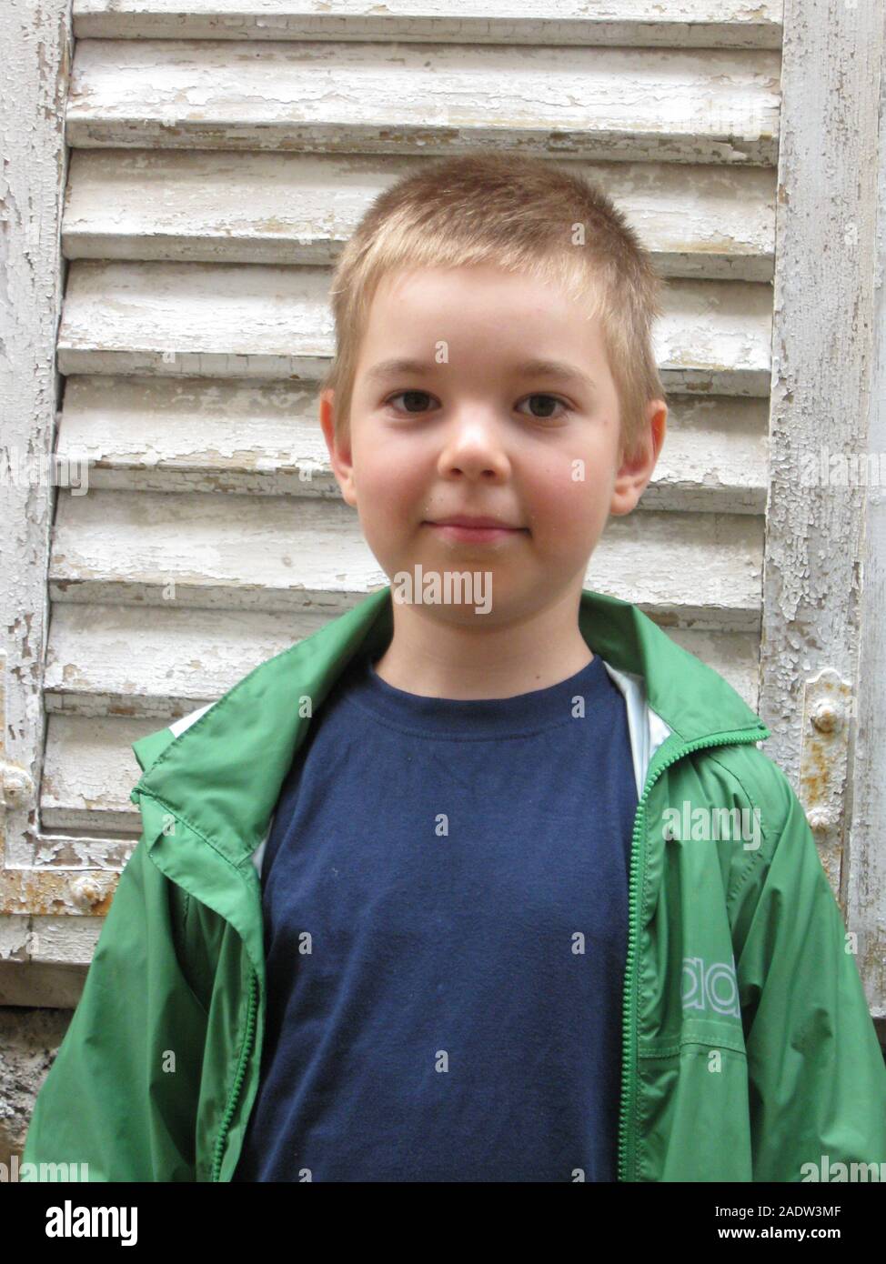 Boy portrait, stony background, funny face expression. Stock Photo
