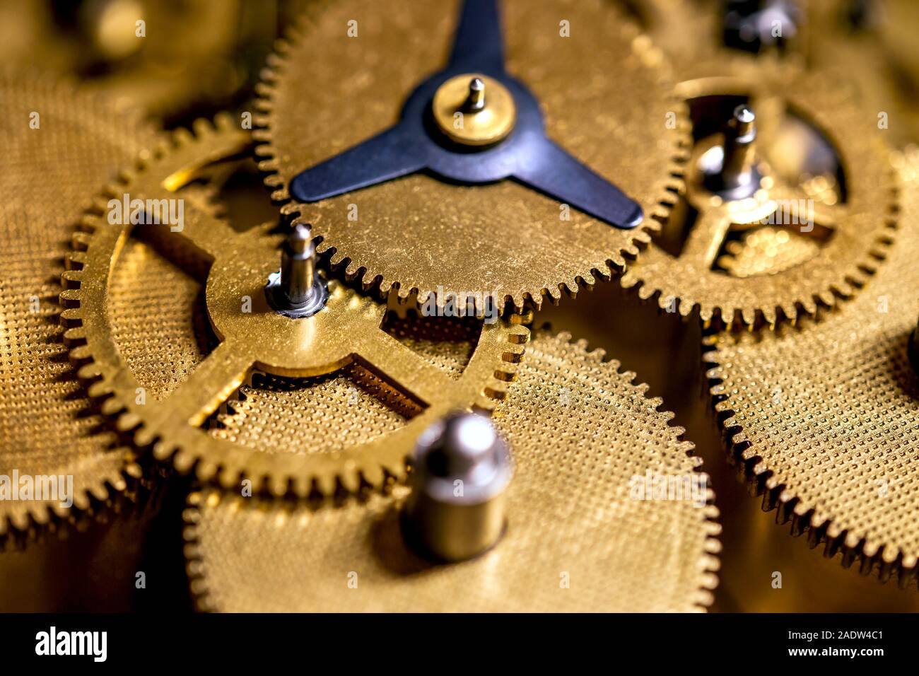 Macro details of gearwheels from a clockwork, precision and accuracy Stock Photo