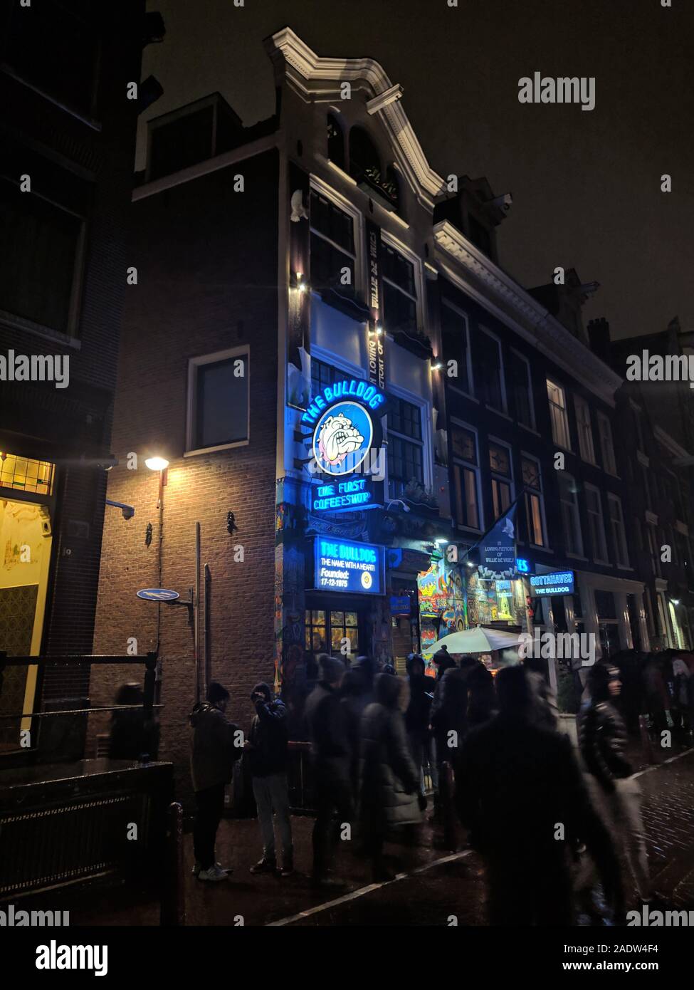 AMSTERDAM, NETHERLANDS, January 2019, People infront of Bulldog, the first ever legal weed shop in city Stock Photo