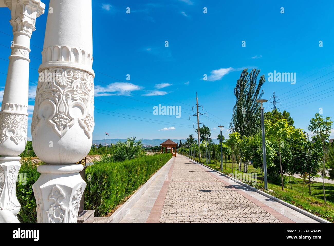 Dushanbe Youth Park Leading Lines View of Pavilion with Tajikistan Ornaments Decorated Columns on a Sunny Blue Sky Day Stock Photo