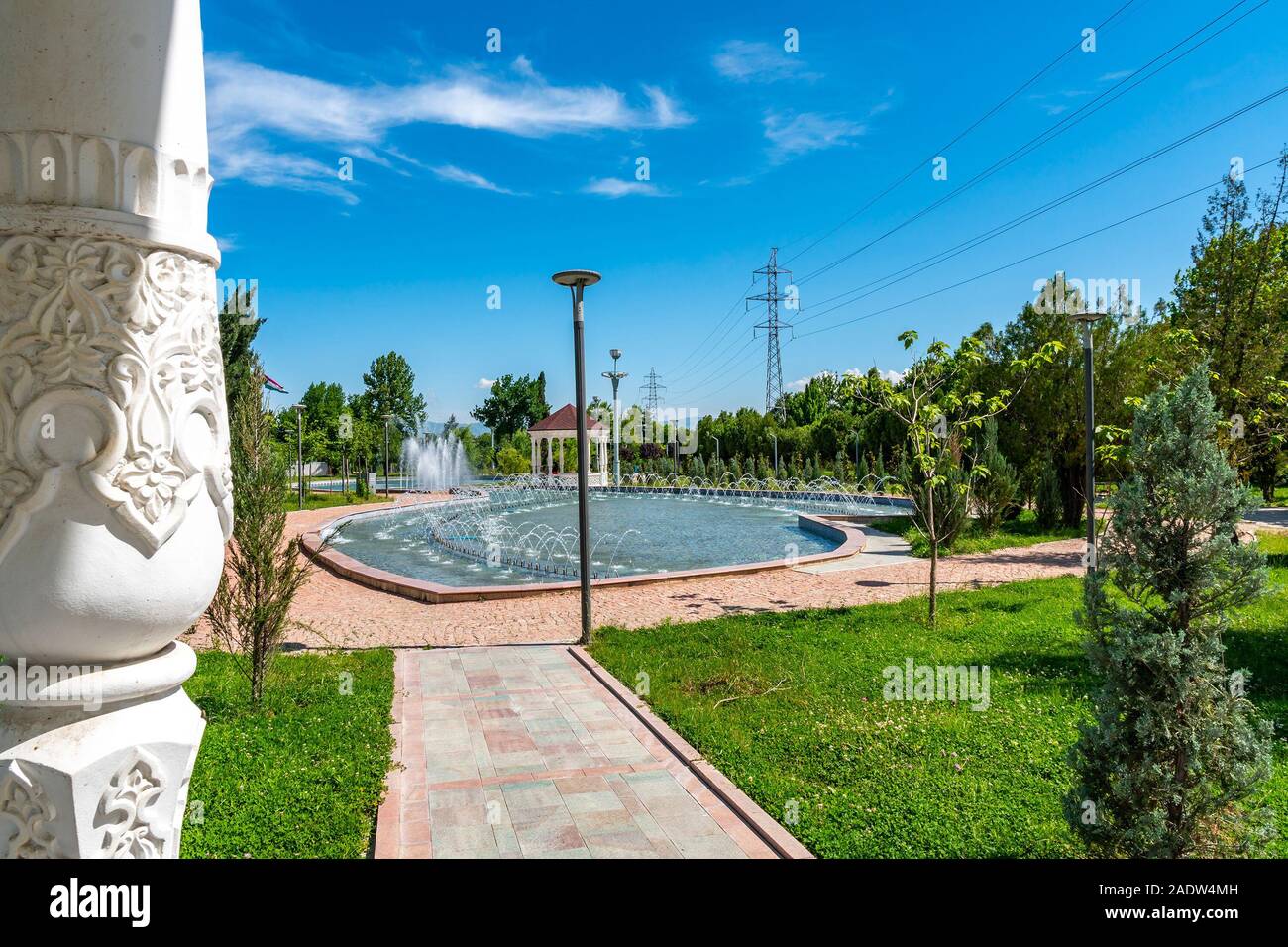 Dushanbe Youth Park Leading Lines View of Pavilion with Tajikistan Ornaments Decorated Columns and Fountain on a Sunny Blue Sky Day Stock Photo