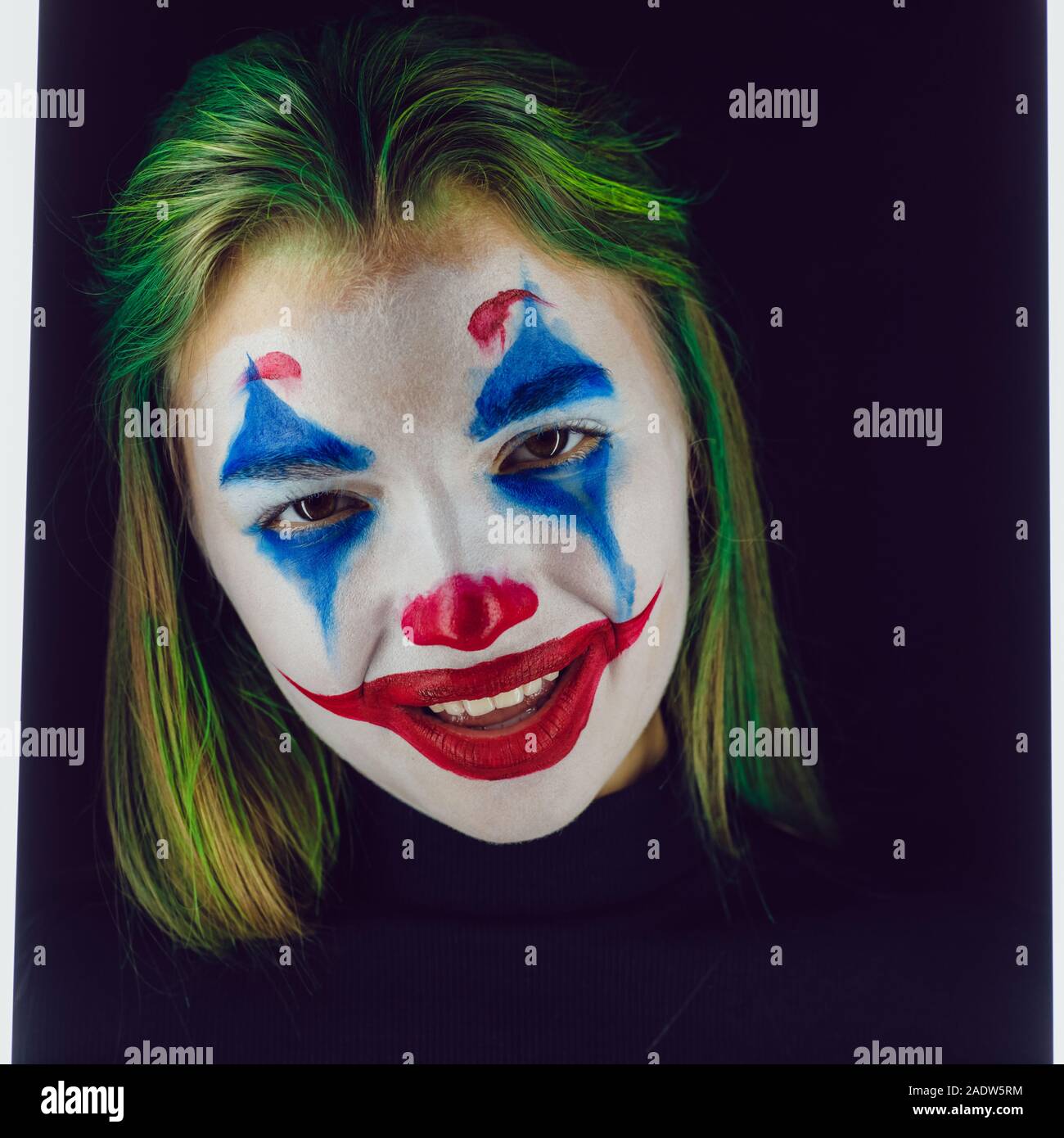 Portrait Of A Girl With Clown Makeup On A Black Background Stock Photo Alamy Portrait Of A Girl With Clown Makeup On A Black Background Stock Photo Alamy