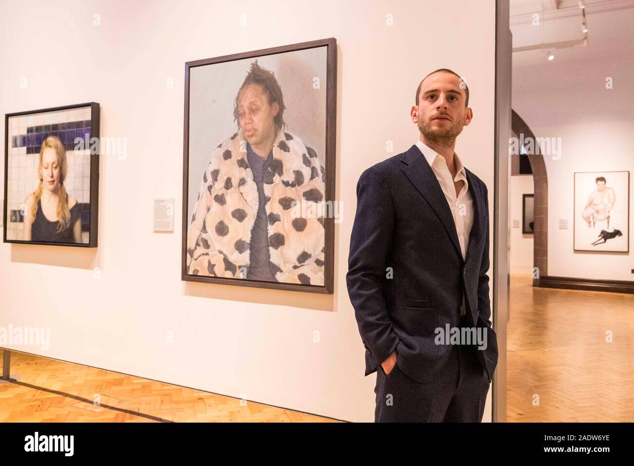 Edinburgh, United Kingdom. 05 December, 2019 Pictured: Charlie Schaffer and Imara in her Winter Coat at the BP Portrait Award Exhibition. The BP Portrait Award is the most prestigious portrait painting competition in the world and represents the very best in contemporary portrait painting. The BP Portrait Award is now in its tenth year at the Scottish National Portrait Gallery. Credit: Rich Dyson/Alamy Live News Stock Photo