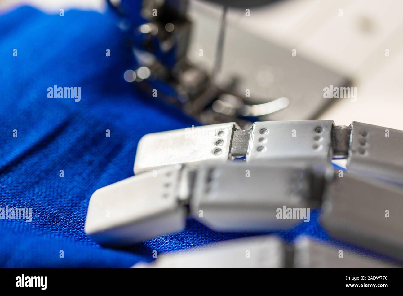 industrial mass production of clothes in an textile fabric, closeup of