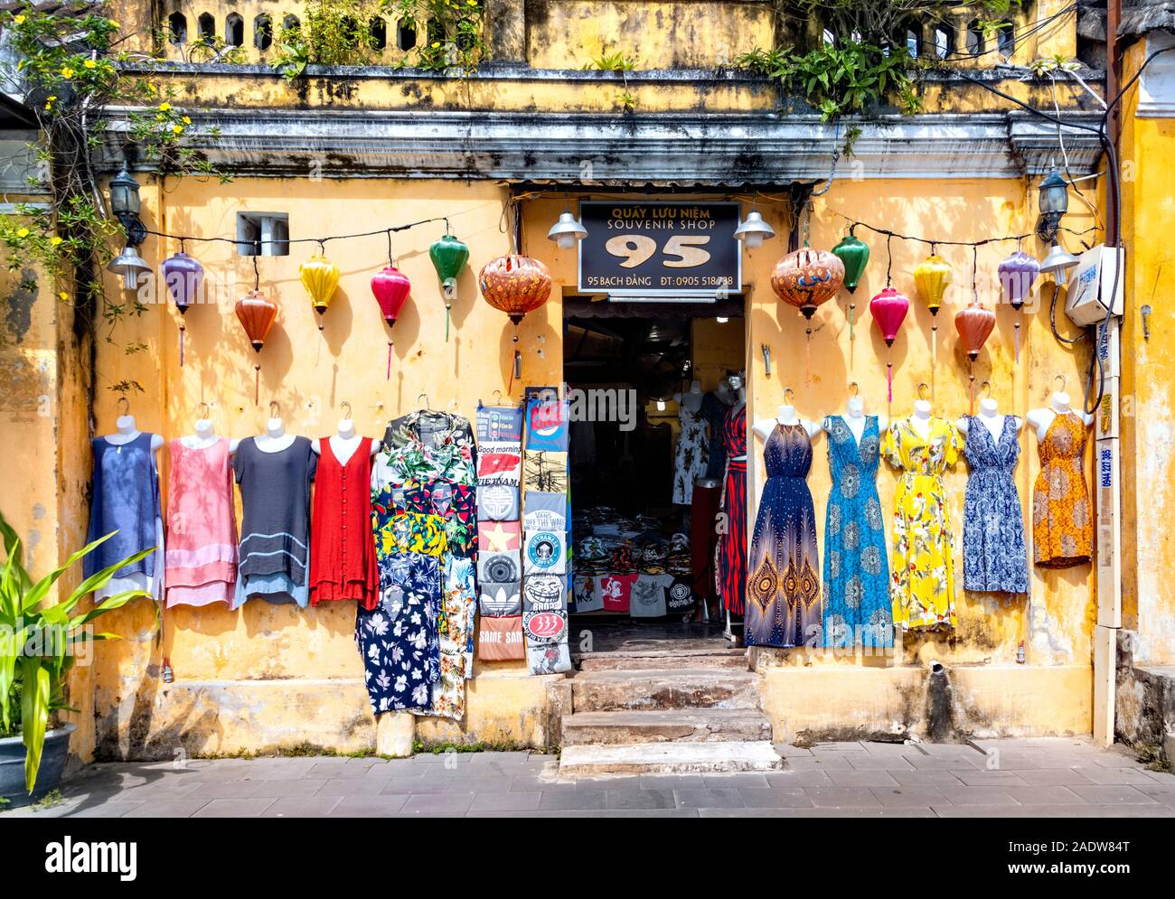 Shops selling clothing and souvenirs along the riverfront,  Hoi An Vietnam Stock Photo