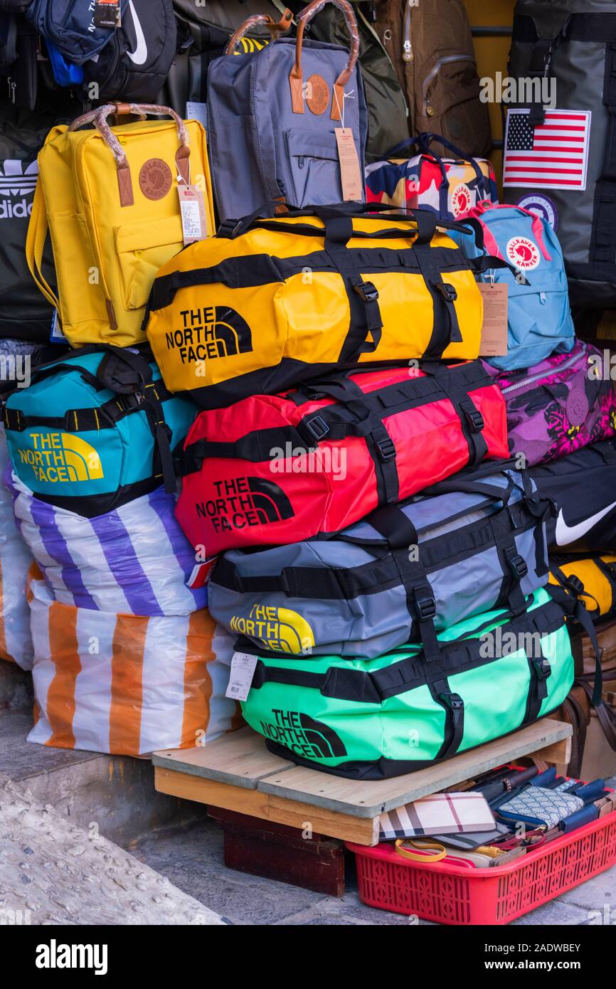 North Face colourful luggage for sale Hoi An Old Quarter Vietnam Stock  Photo - Alamy