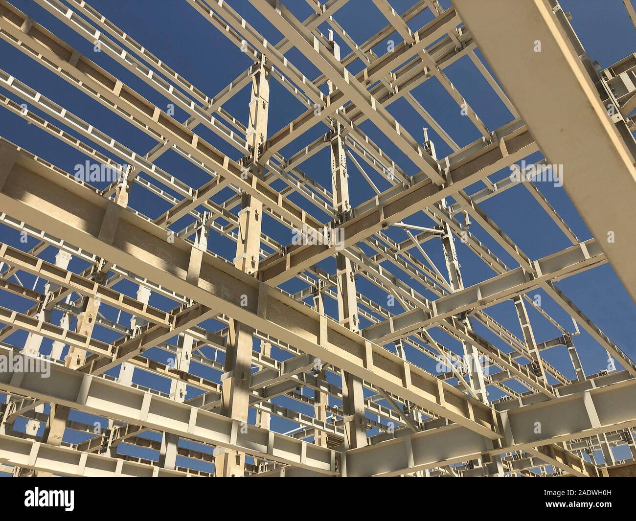 Metal frame of prefabricated multi-storey building. Metal pillars, beams and diagonal bracings Stock Photo
