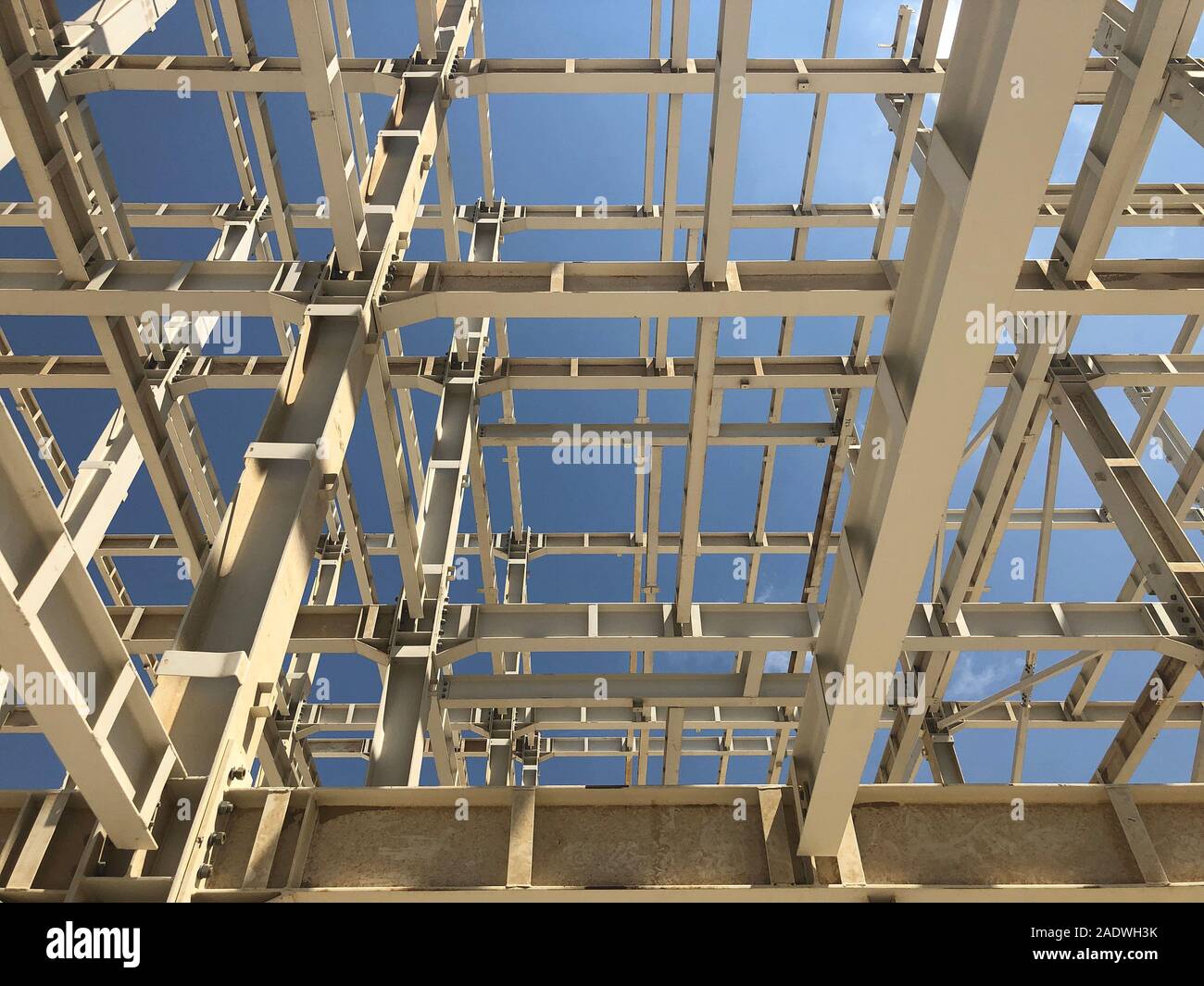Metal frame of prefabricated multi-storey building. Metal pillars, beams and diagonal bracings Stock Photo