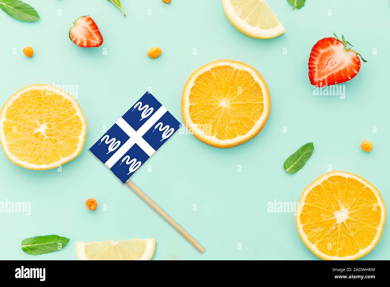 Martinique Paper Stick Flag. National summer fruits concept, local food market. Vegetarian theme. Stock Photo
