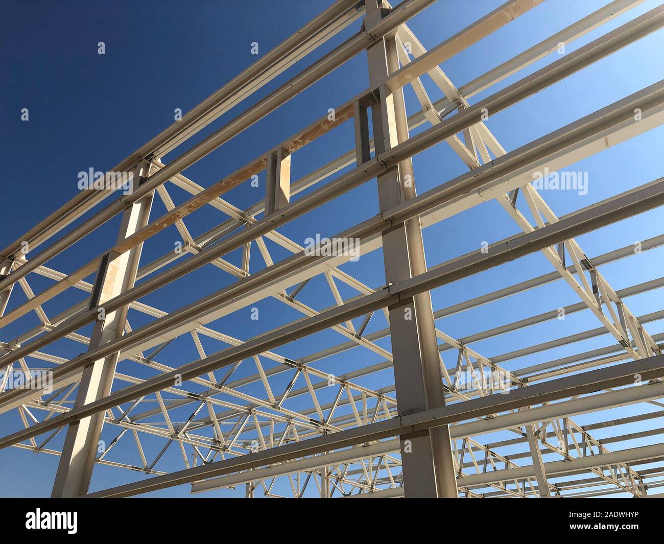Truss ceiling and metal pillars and girders. Support constructions. Industrial building metal framework. Stock Photo