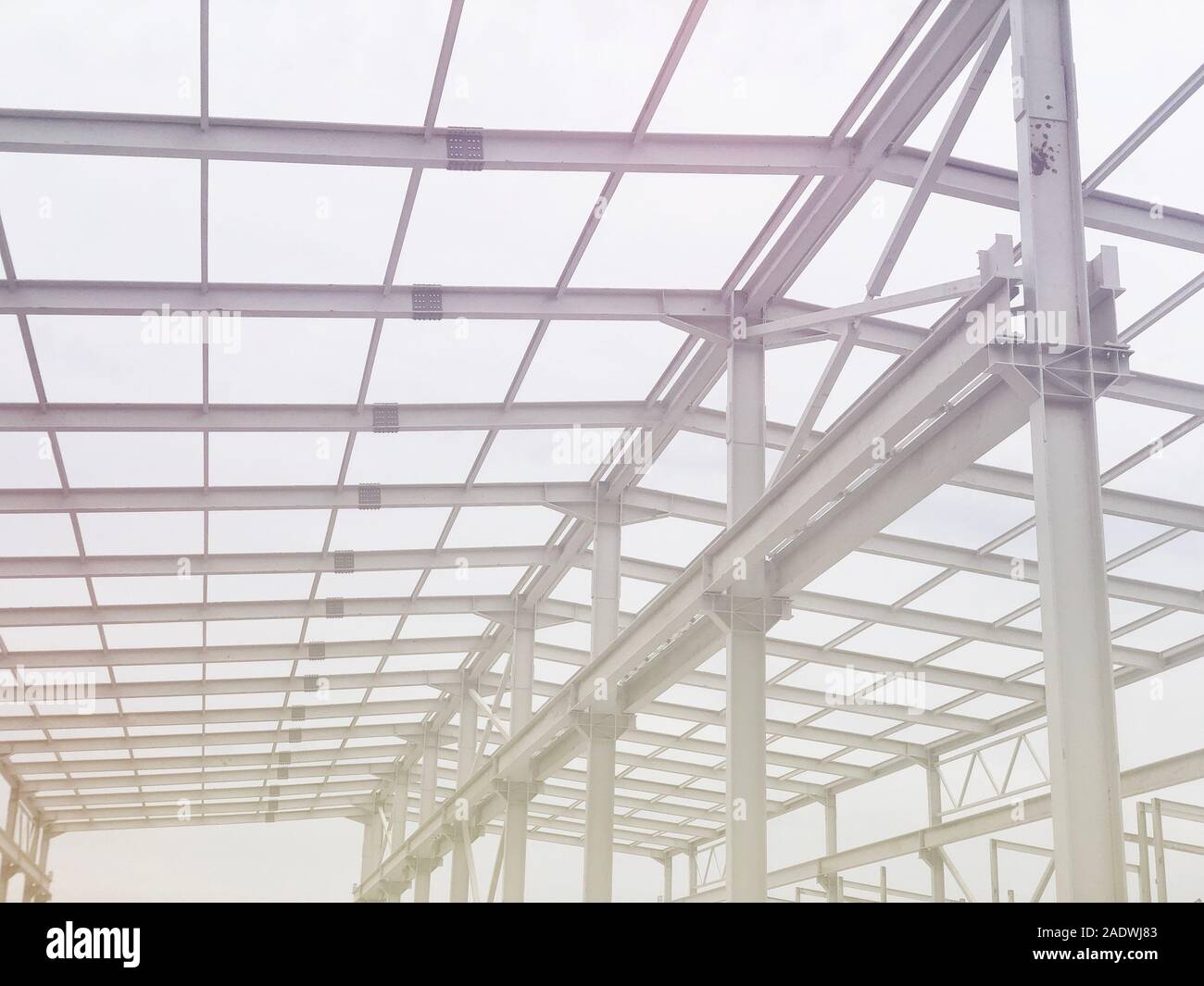 Metal frame of prefabricated multi-storey building. Metal pillars, beams and diagonal bracings Stock Photo