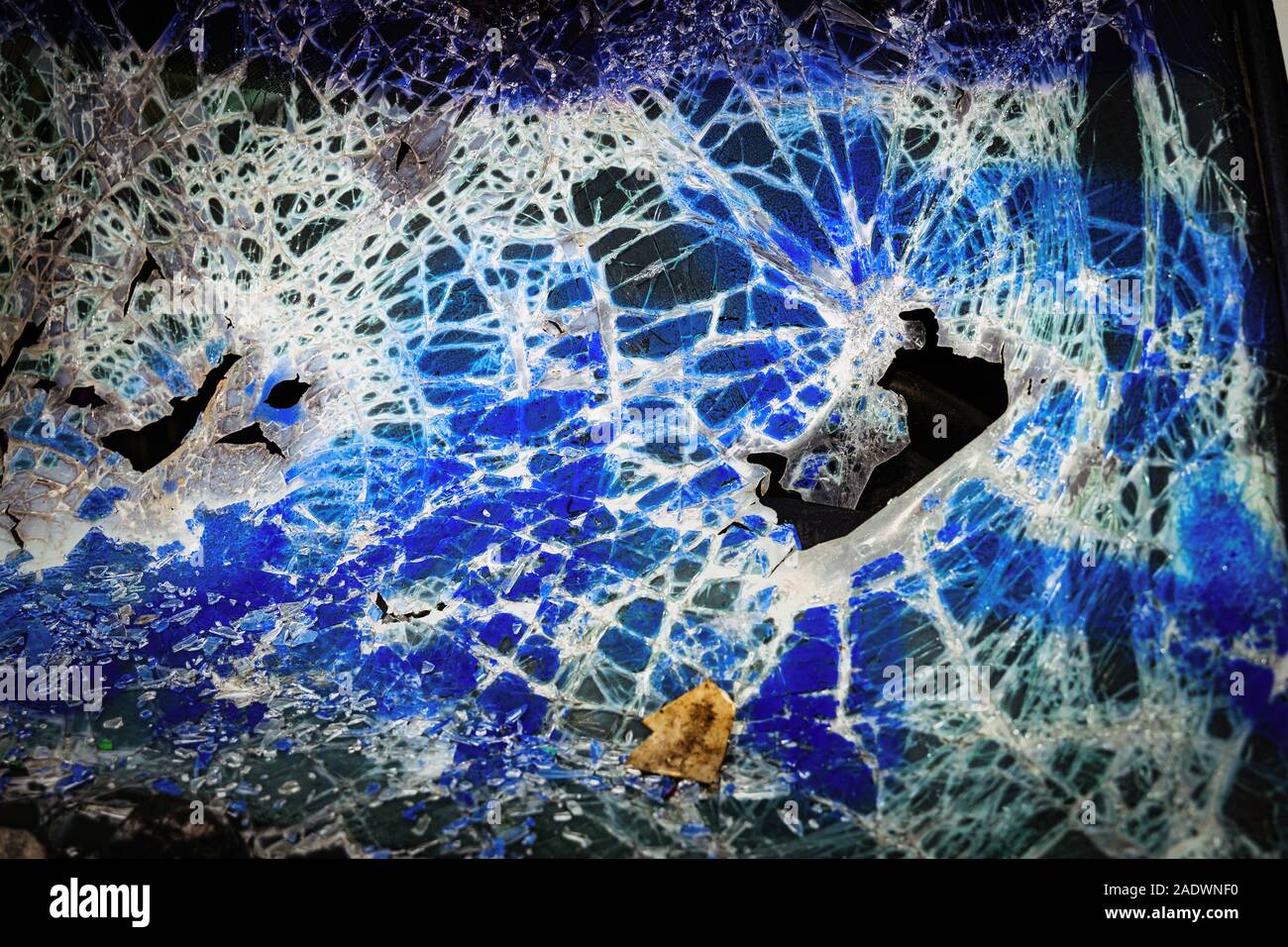 Vandalized windscreen on abandoned car Stock Photo