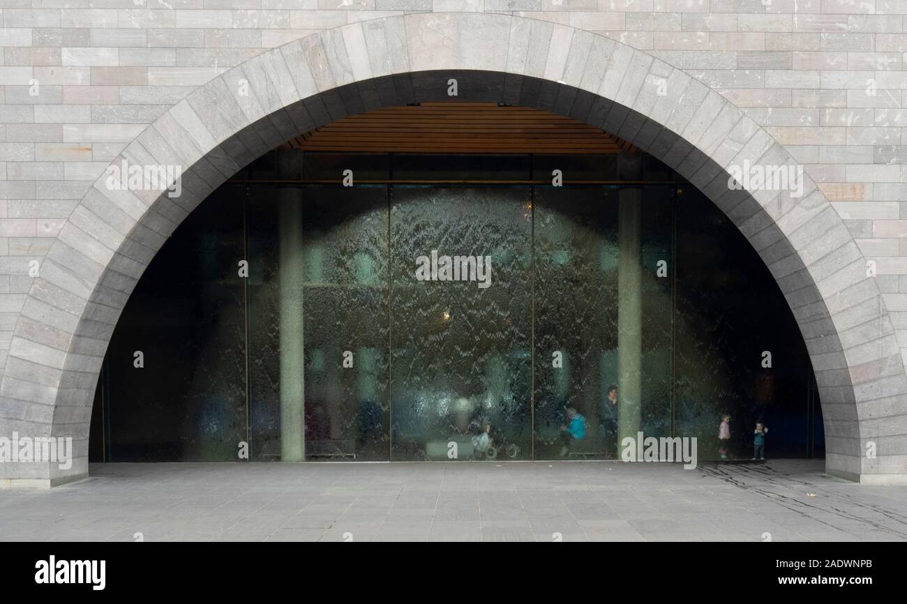 Entrance to National Gallery of Victoria NGV and semi circular glass water wall or water feature, Melbourne Victoria Australia. Stock Photo