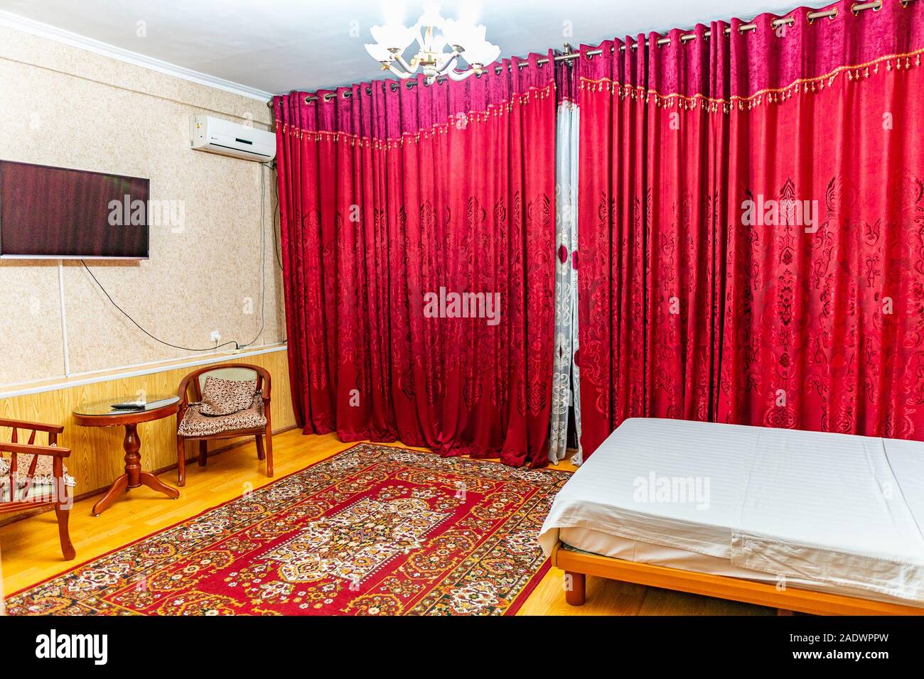 Hotel Simple Clean Double Bedroom With Red Colored Curtain And