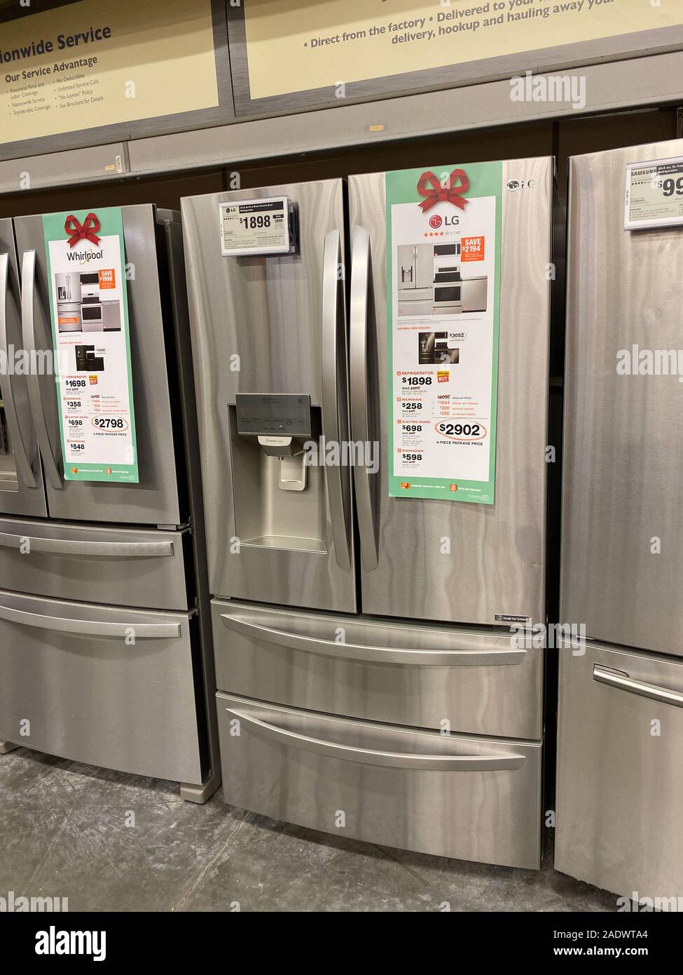 Orlando,FL/USA-11/11/19: A LG, Samsung, and Whirlpool stainless steel french door refrigerators on sale at a Home Depot Store. Stock Photo