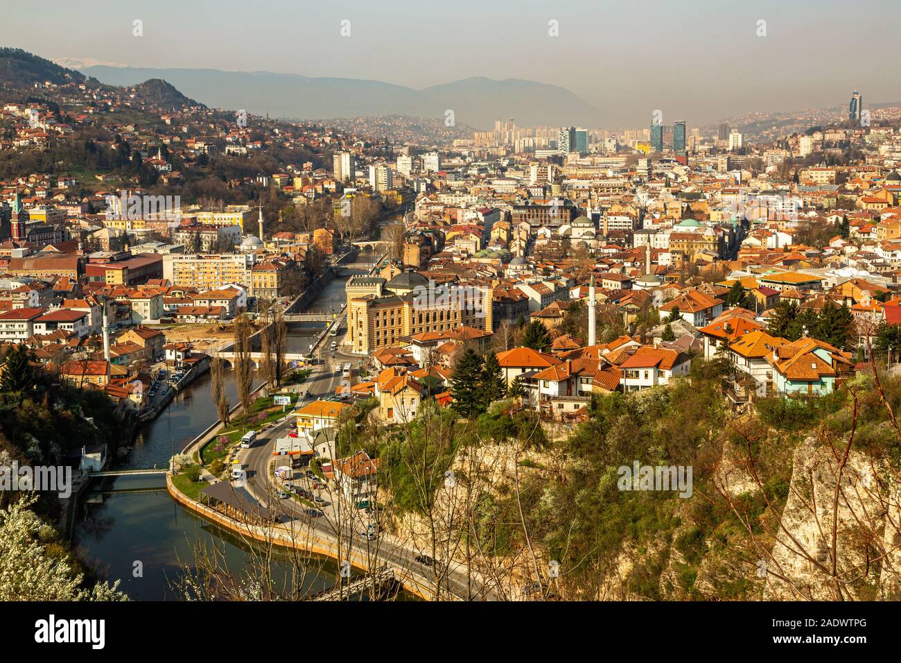 An elevated aerial view daytime view of Sarajevo, capital of Bosnia and Herzegovina surrounded by the Dinaric Alps and the Miljacka River in view Stock Photo