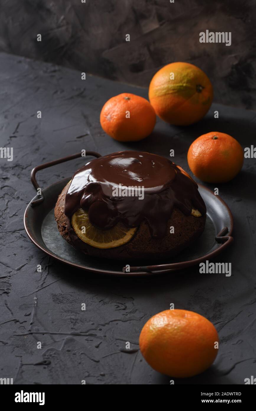 Old fashion British dessert. Steam chocolate pudding with oranges and
