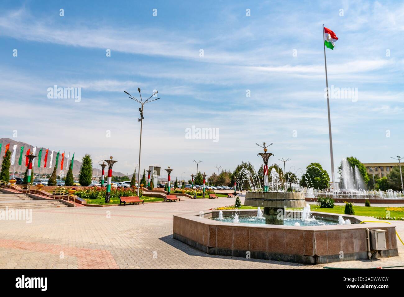 Khujand Waving Tajikistan Flag near Sughd Hukumat City Region Government on a Sunny Blue Sky Day Stock Photo